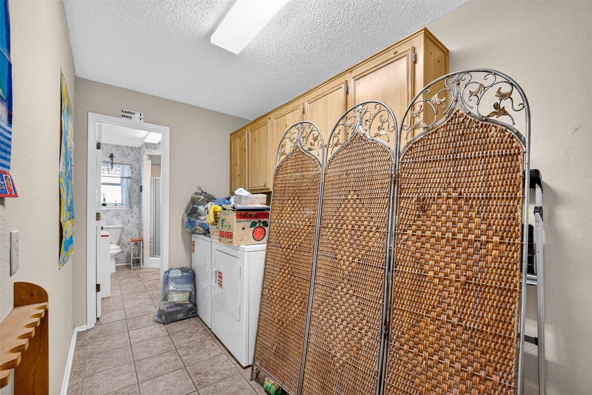 Utility room just off the living area with full bathroom in the back - note washer/ dryer included