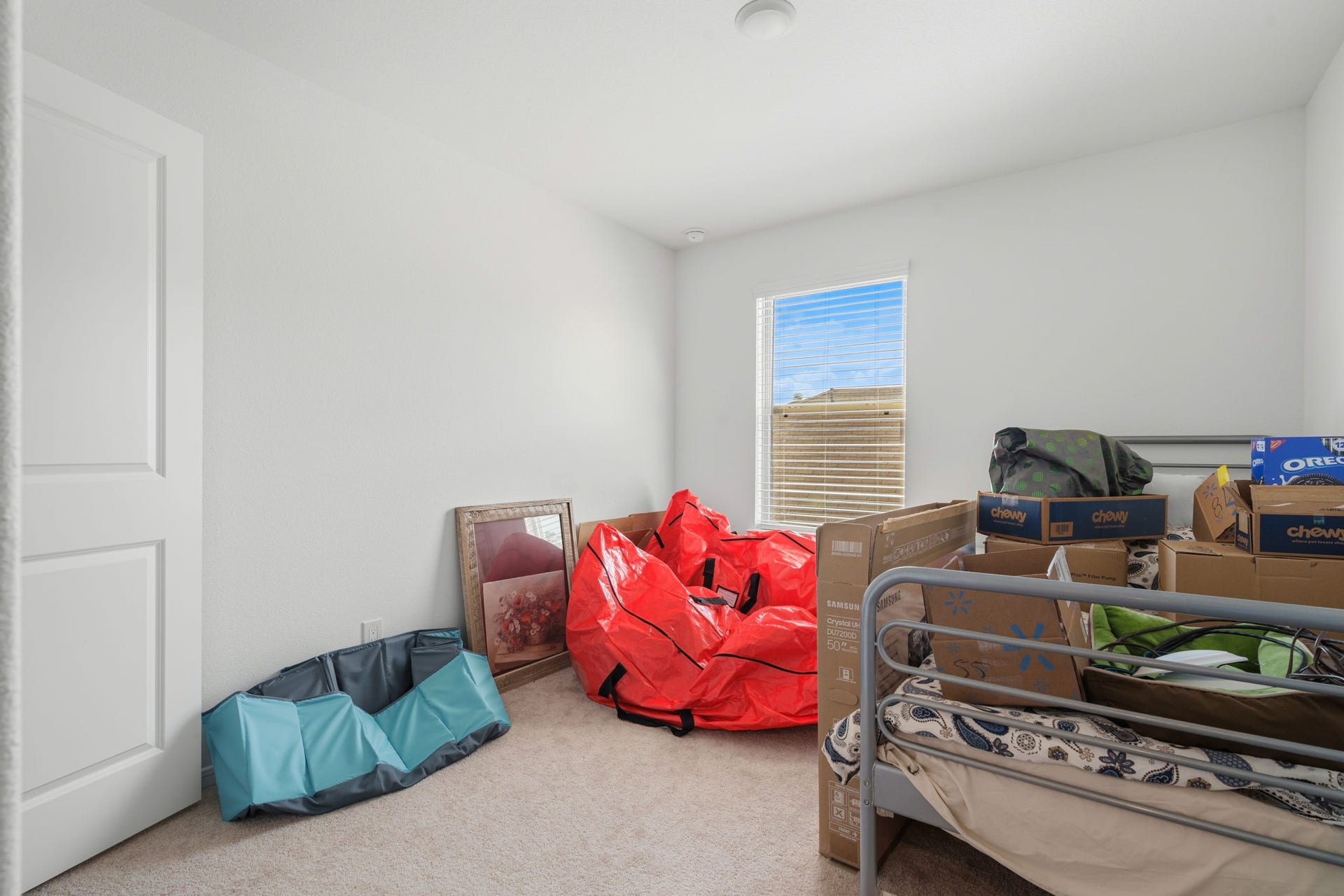 122 Ashwood Glade Lane, Conroe, TX 77378 Bright, versatile room with natural light, perfect for a cozy bedroom or functional office space.