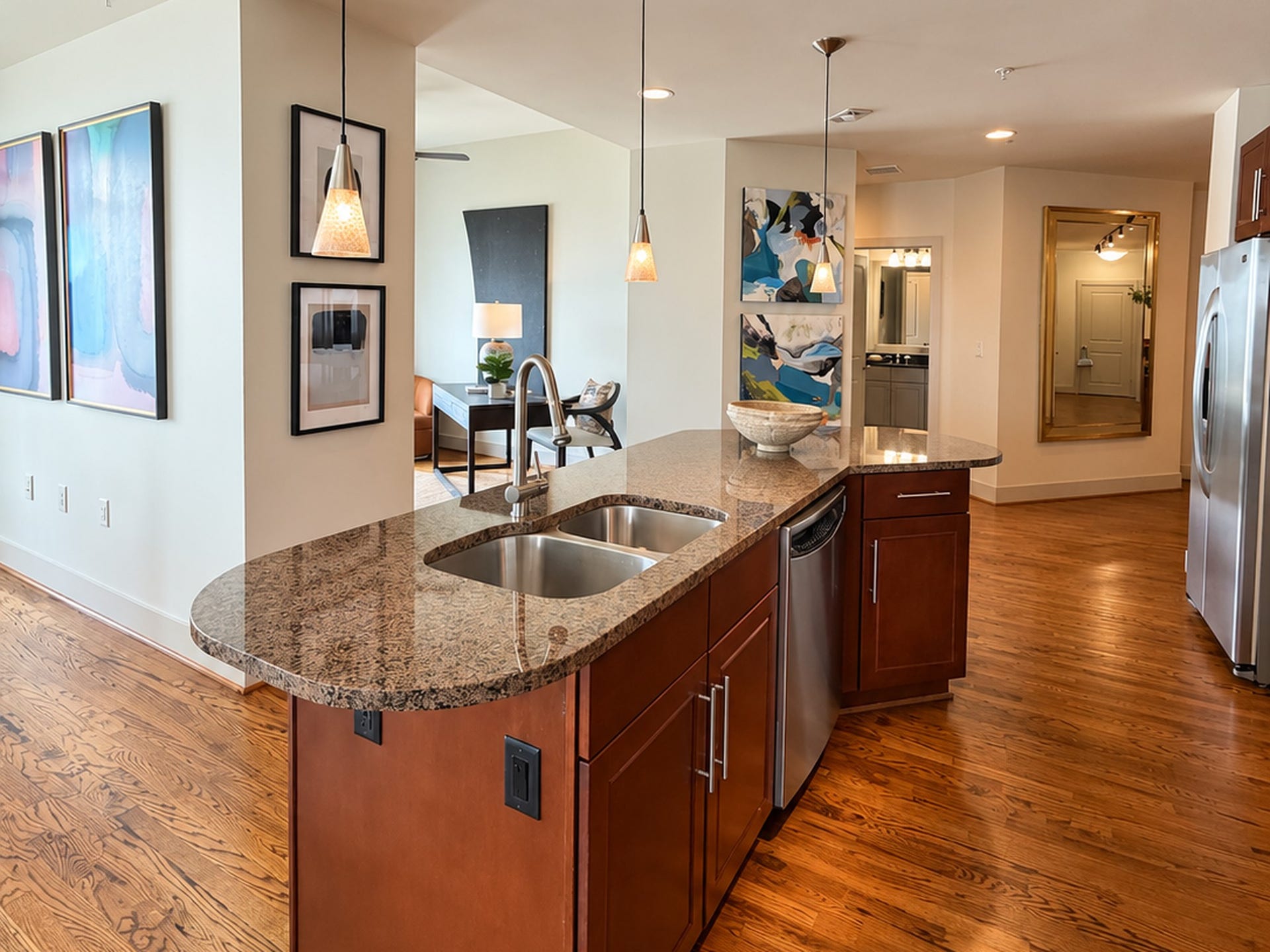 At the heart of the residence, the oversized island connects the kitchen naturally to the surrounding living spaces. Its easy to picture friends gathering here with a glass of wine while dinner is prepared, a layout that makes entertaining feel instinctive rather than staged.