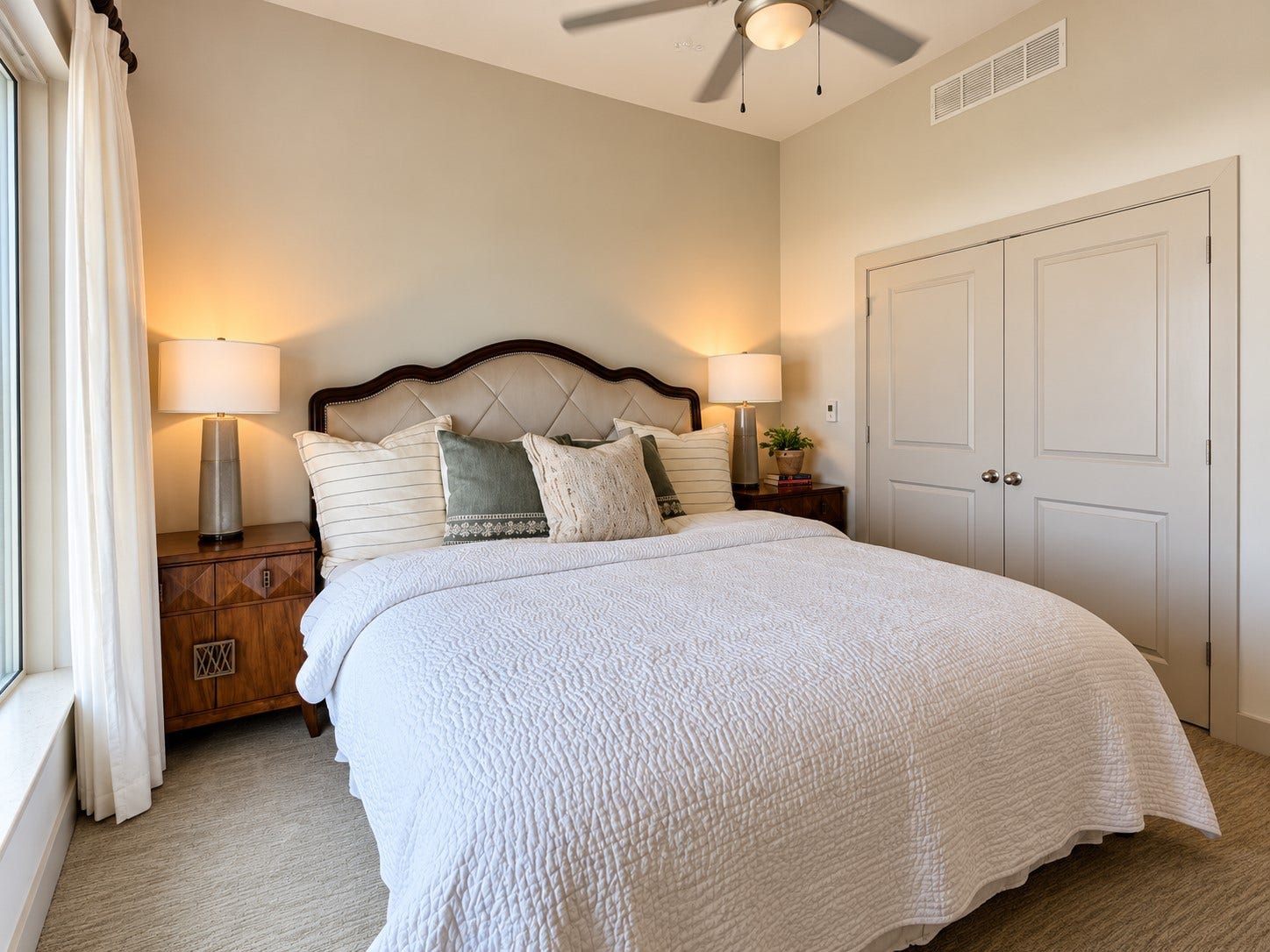 Calm, comfortable, and beautifully proportioned, this bedroom feels like its own private escape. High ceilings enhance the sense of space, while layered textures and warm lighting show just how inviting high-rise living can feel.