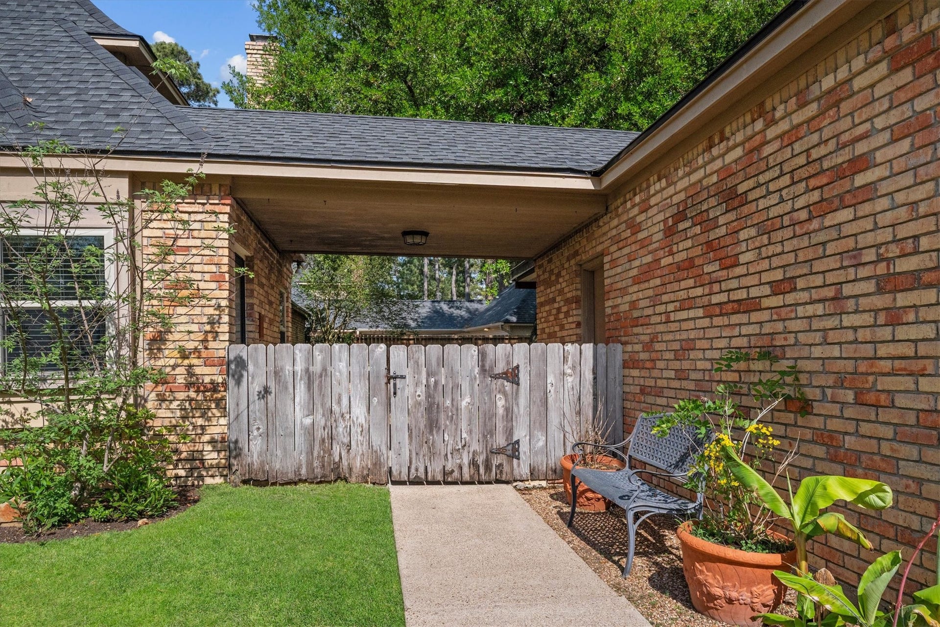 This fully fenced backyard opens to a sidewalk connecting the driveway, and makes it easy to commute to the school or playground across the street!