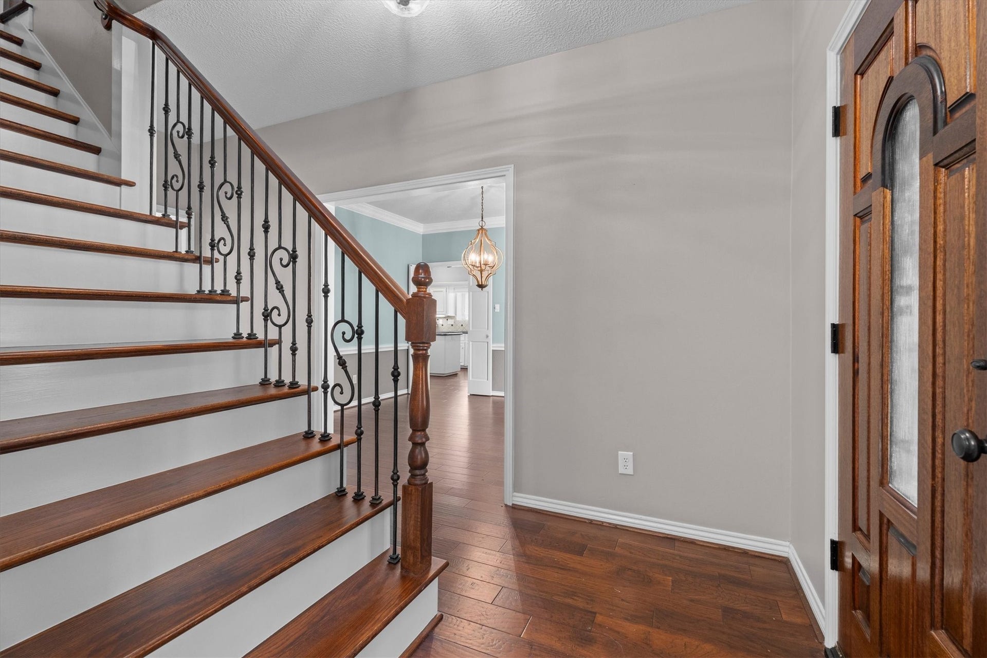 The staircase has also been updated with wood floors and wrought iron balusters.