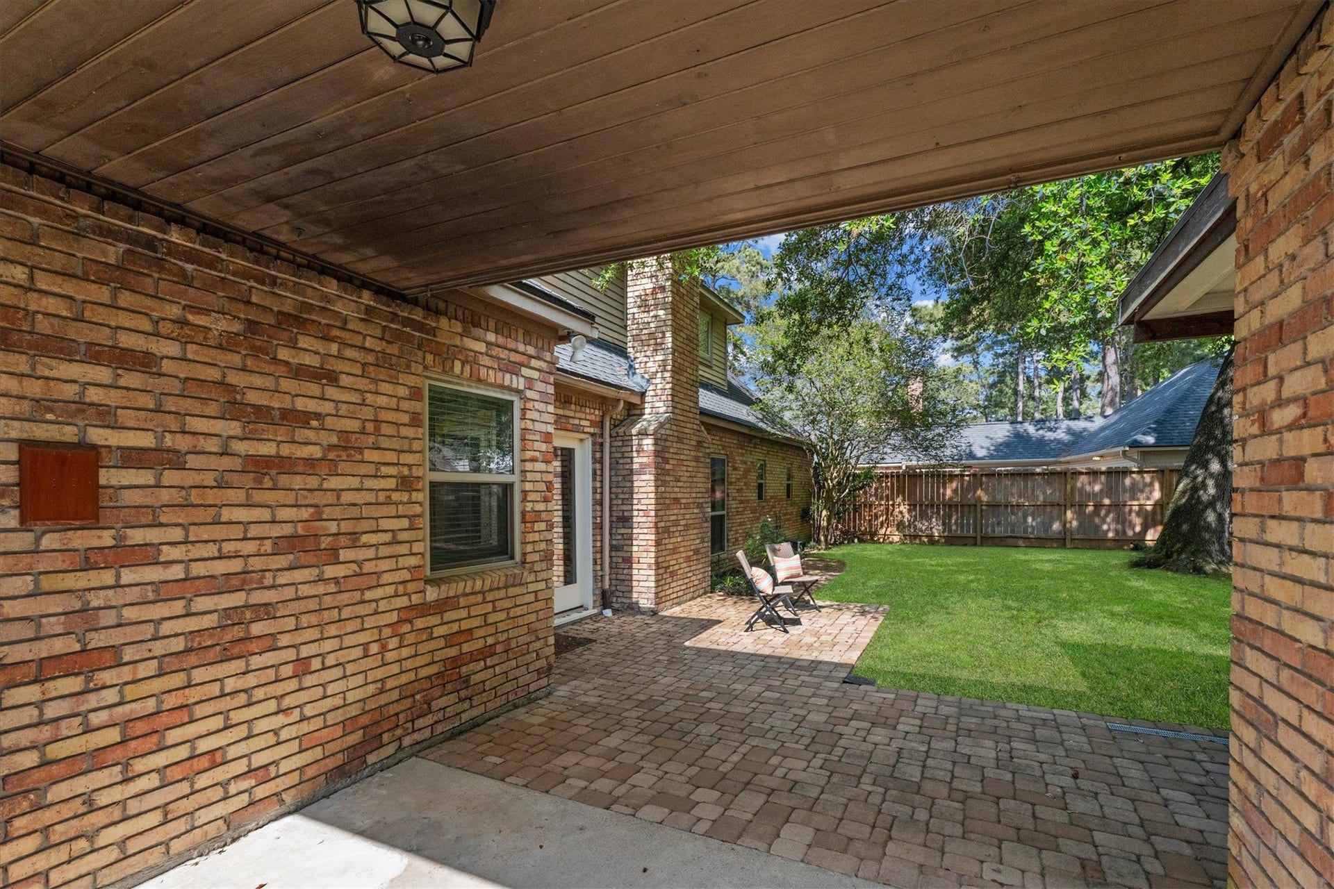 A covered walkway connects the garage to the kitchen.
