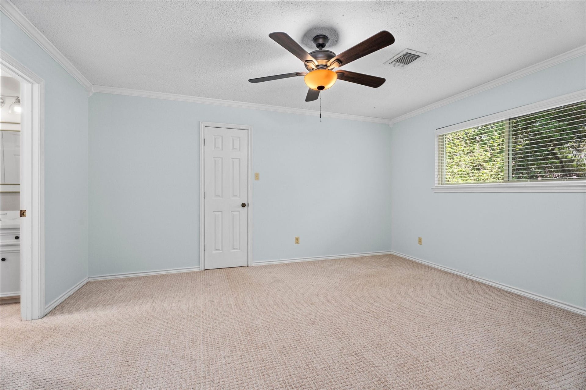 Upstairs are 3 bedrooms and 2 baths with neutral colors and carpet. Each room includes their own large walk-in closets.