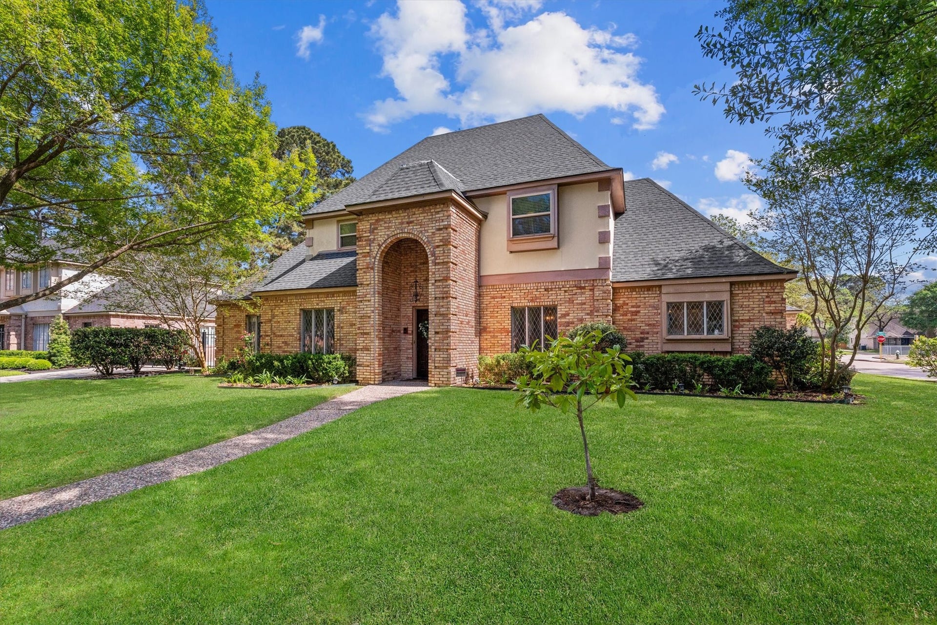 Situated on a large corner lot with lovely oak trees, this home is also a prime neighborhood location at a quiet intersection, across from the neighborhood elementary school and playground.