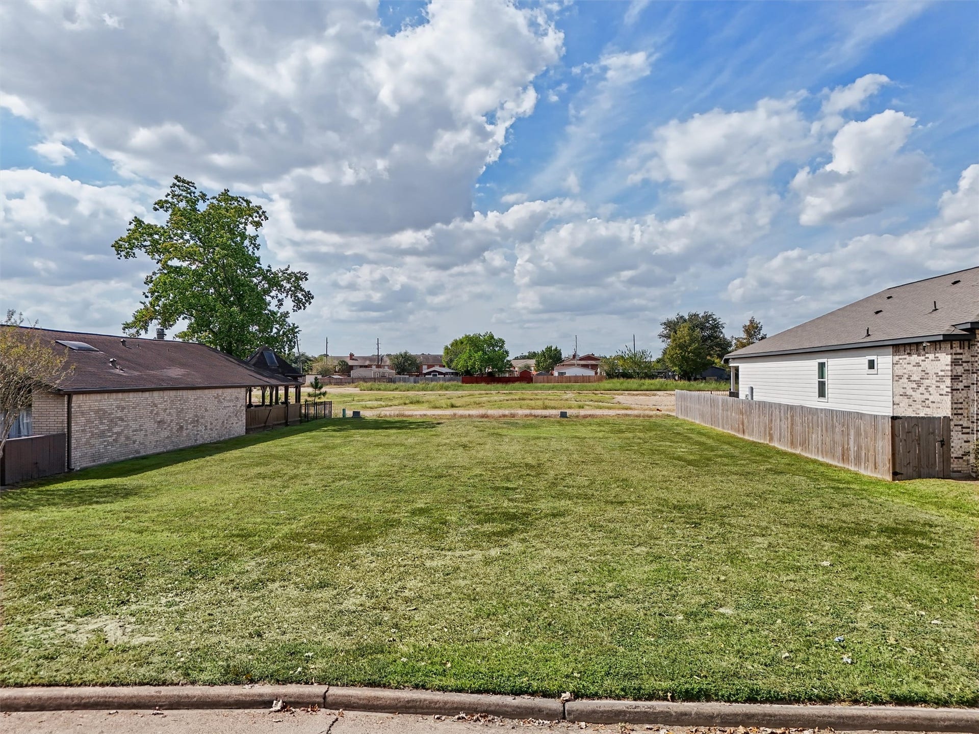 7713 Green Lawn Drive, Houston, TX 77088 BUILD YOUR DREAM HOME WITH NO BACK NEIGHBORS! Imagine creating your custom dream home on this spacious, cleared residential lot with the added appeal of no immediate rear neighbors! Enjoy an open view behind the property, offering a sense of space and privacy that's hard to find.