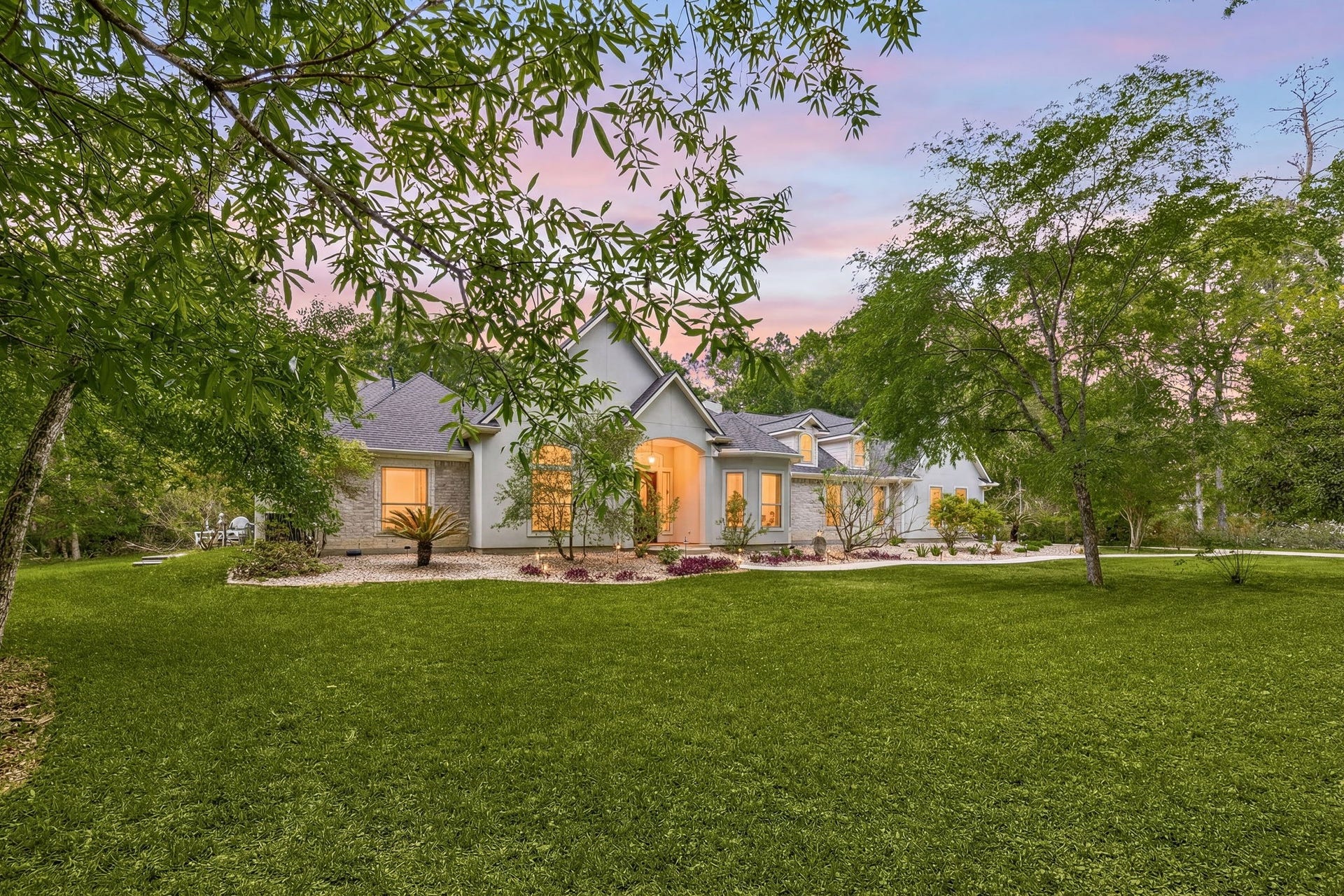 11956 White Oak Crossing, Conroe, TX 77385 Mature landscaping design that enhances the home's curb appeal
