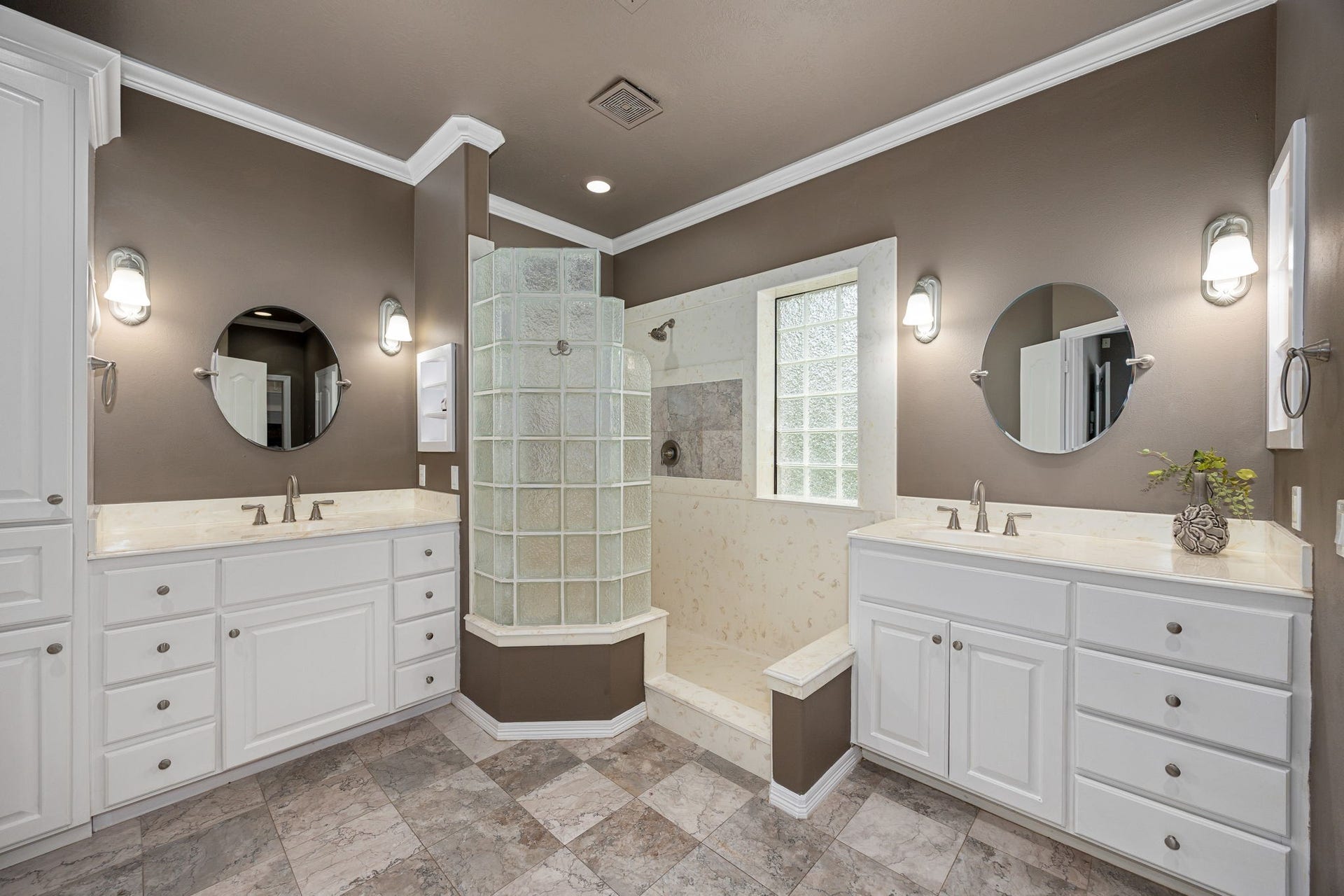 11956 White Oak Crossing, Conroe, TX 77385 Primary bathroom featuring dual vanities, and a spacious walk-in shower with designer tile accents.