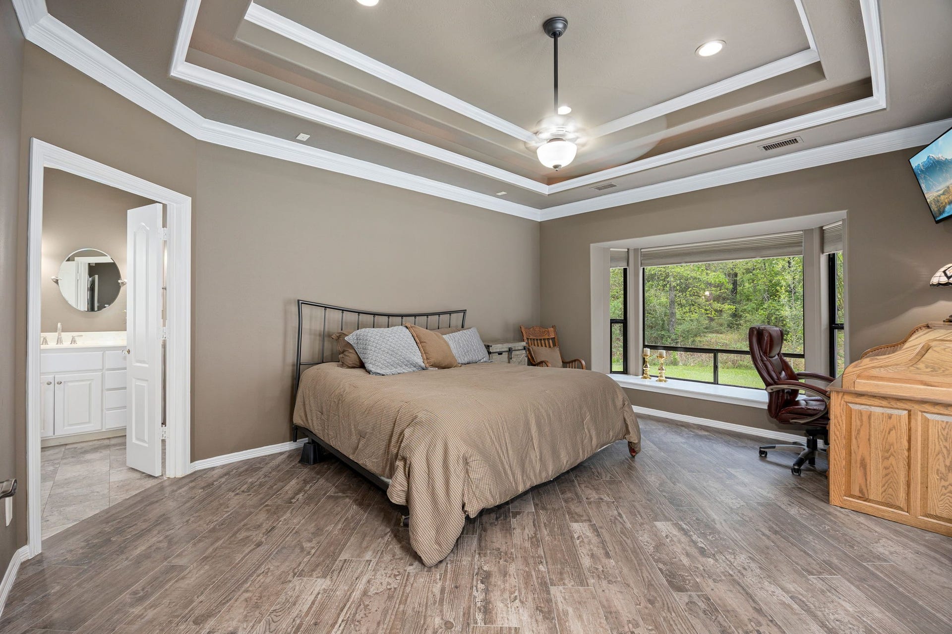 11956 White Oak Crossing, Conroe, TX 77385 Stunning custom tray ceiling design with modern lighting and architectural detailing.