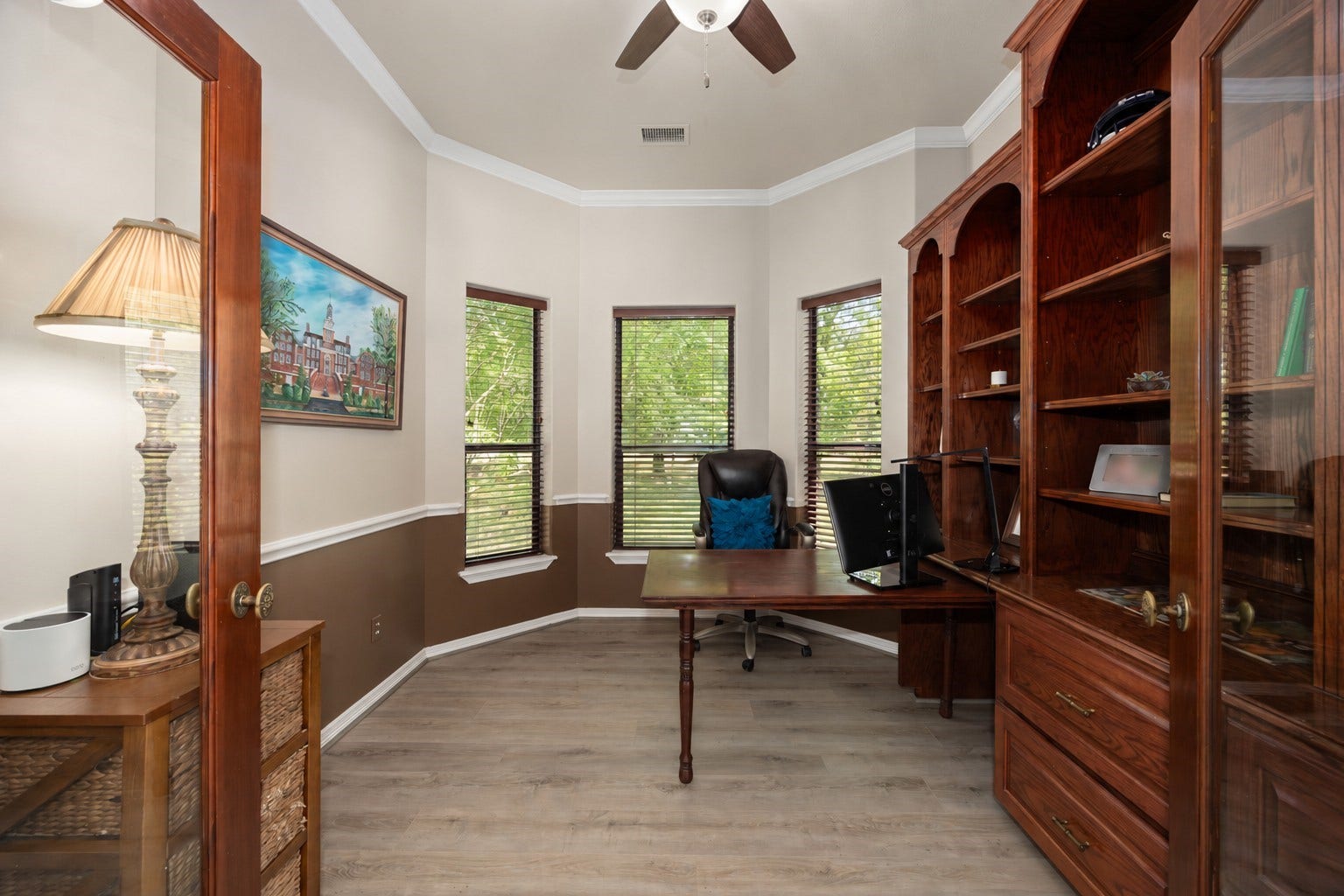 11956 White Oak Crossing, Conroe, TX 77385 Private office featuring double doors and custom built-in shelving.