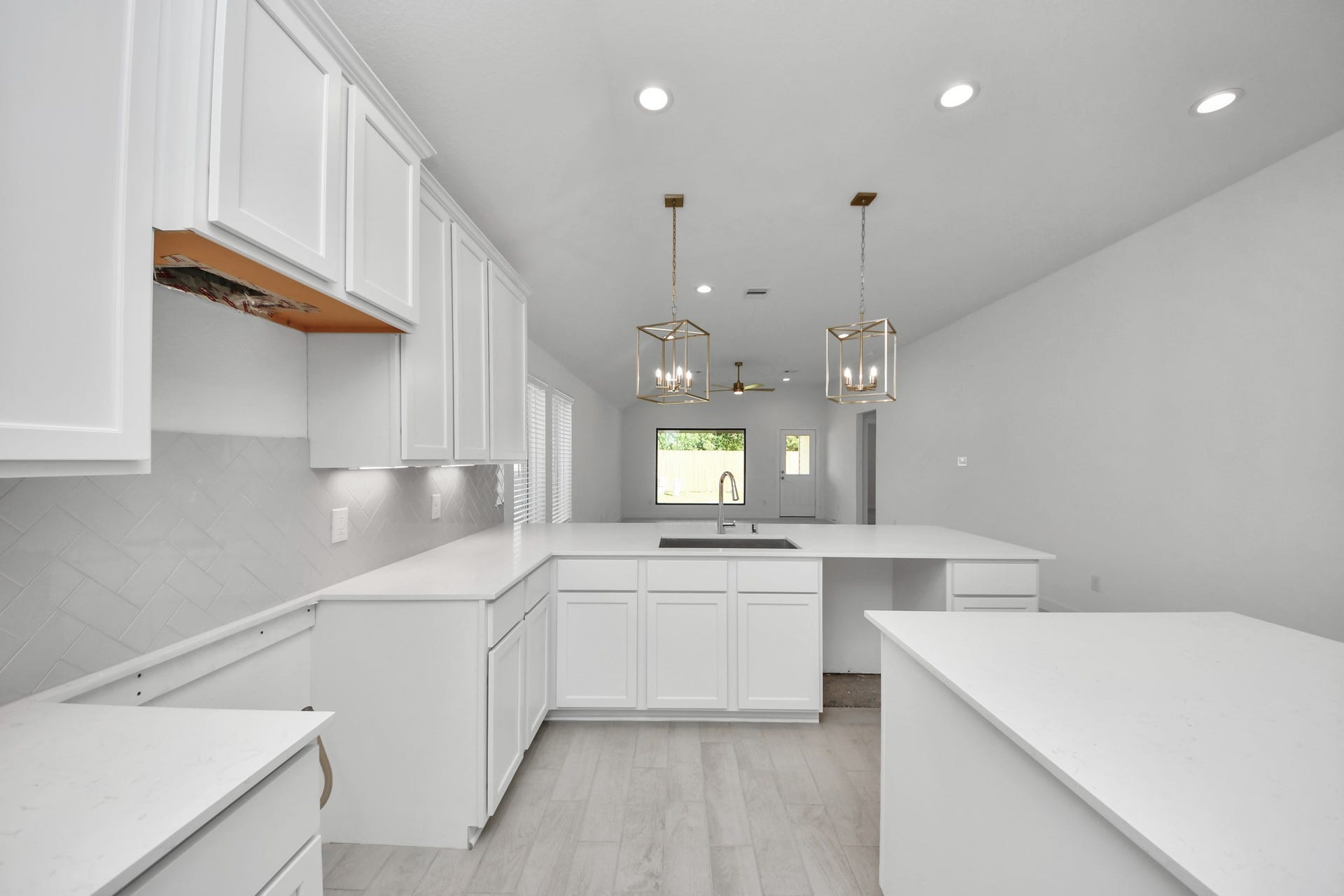 The open concept effortlessly connects the kitchen to the expansive family room, forming a perfect hub for gatherings. This seamless flow creates an inviting space where cooking and socializing come together harmoniously. Sample photo of completed home with similar floor plan. Actual colors and selections may vary.