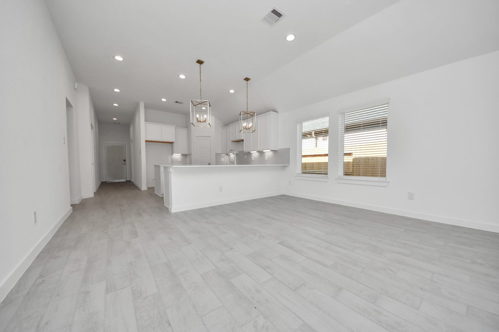 Take another glimpse into the heart of the home with this additional view of the family rooma sprawling space ready to accommodate all your gatherings. Sample photo of completed home with similar floor plan. Actual colors and selections may vary.