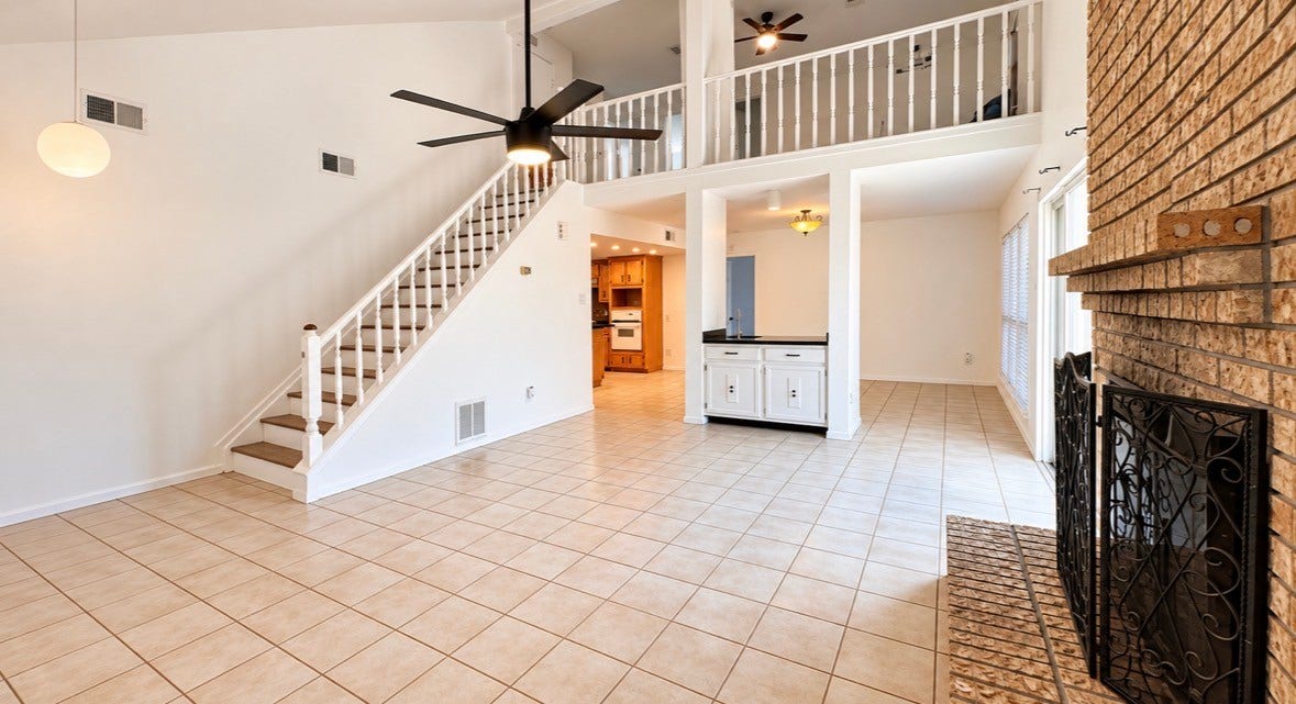 3434 Havershire Drive, Missouri City, TX 77459 Living room overlooking the open living and dining rooms. As well as the Loft - Gameroom
