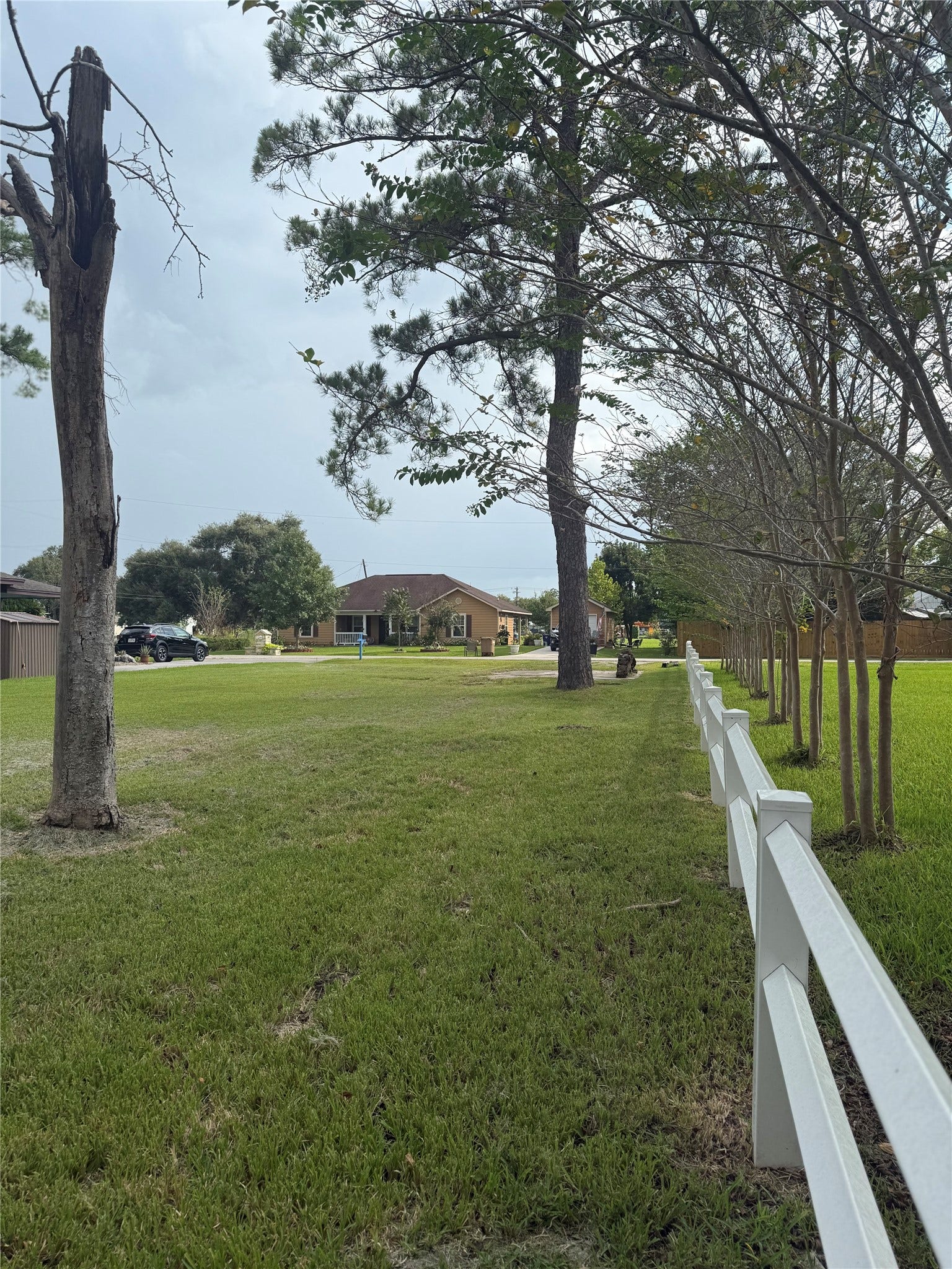 0000 Ave G, Dickinson, TX 77539 View from back of land that is partially fenced.