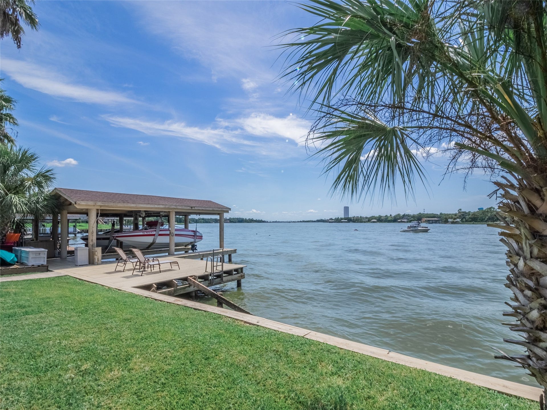 1623 Lake Arbor Drive, El Lago, TX 77586 THE LARGE BACKYARD OVERLOOKS THE BOATHOUSE AND INCREDIBLE LAKE VIEWS.