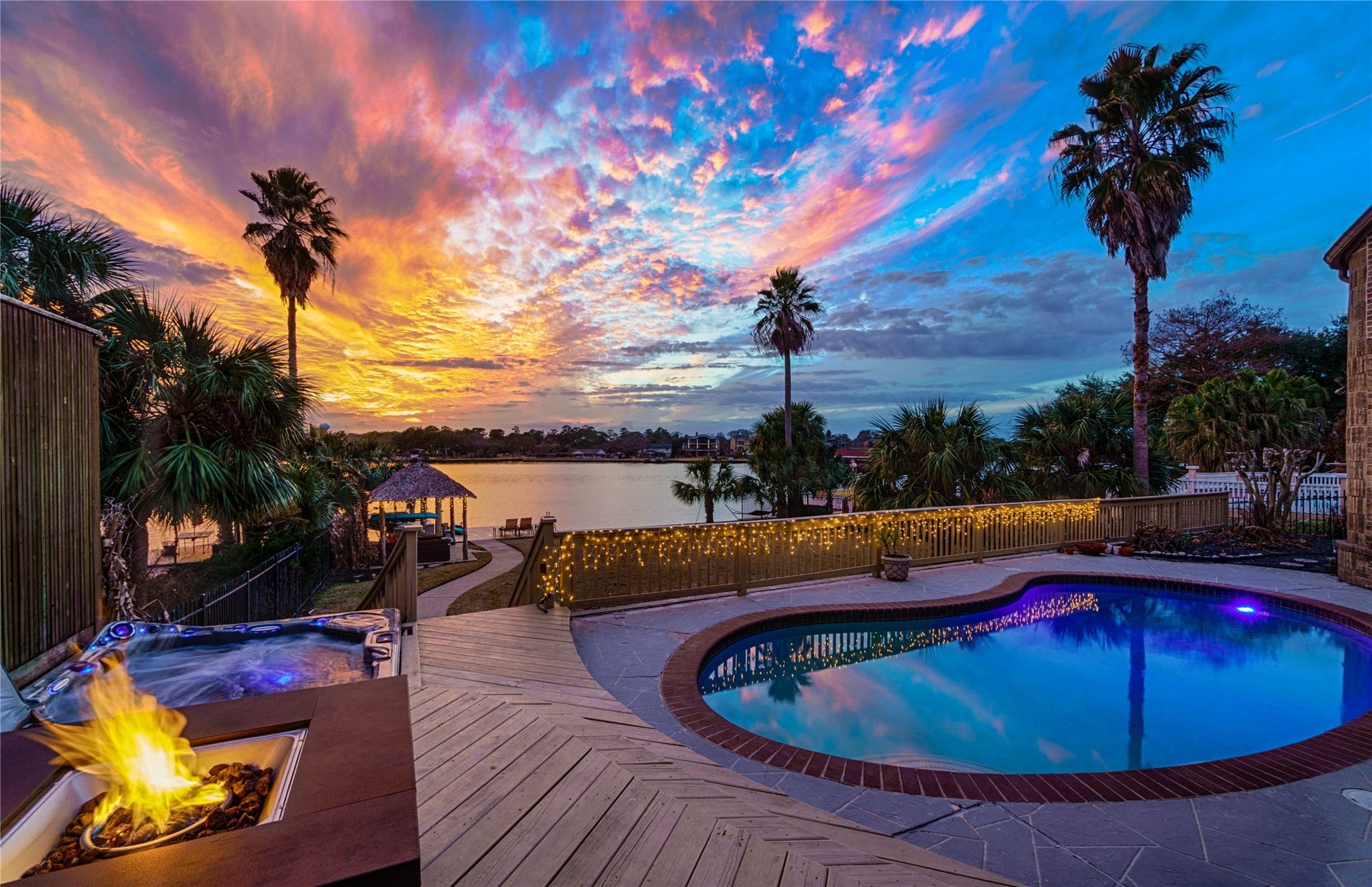 1623 Lake Arbor Drive, El Lago, TX 77586 WATERFRONT LIVING AT IT'S BEST WITH POOL, FIREPIT AND BOATHOUSE ALL OVERLOOKING TAYLOR LAKE.