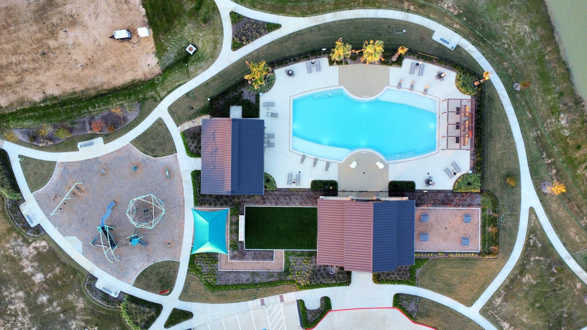 A resort-style community pool offers a refreshing escape from the Texas heat, promising endless splashy fun and relaxation.