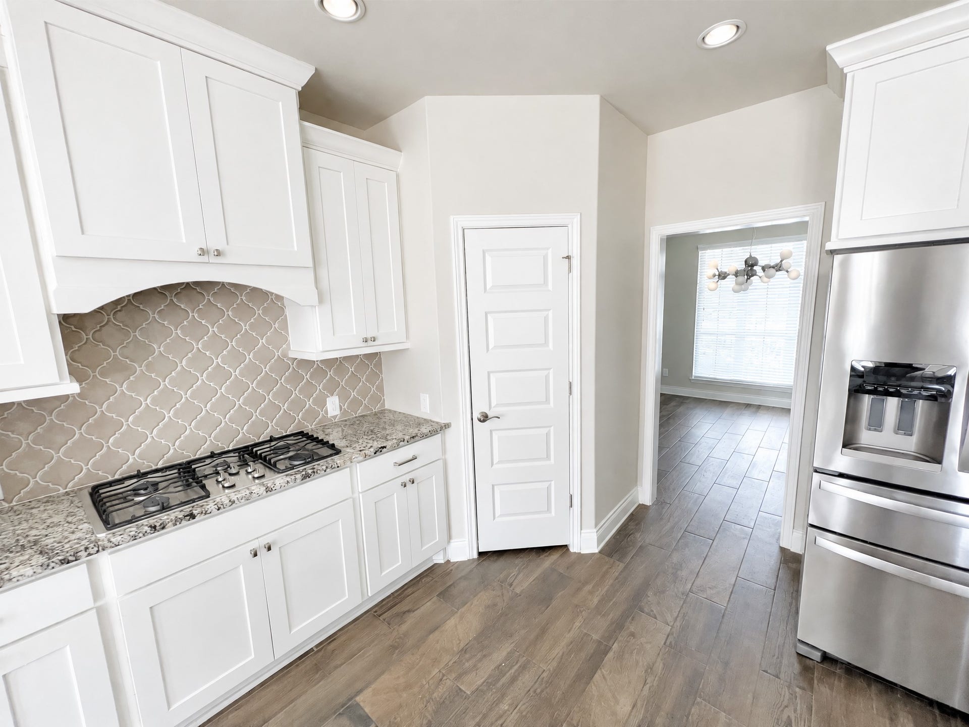 Kitchen contains large gas range with appliances.