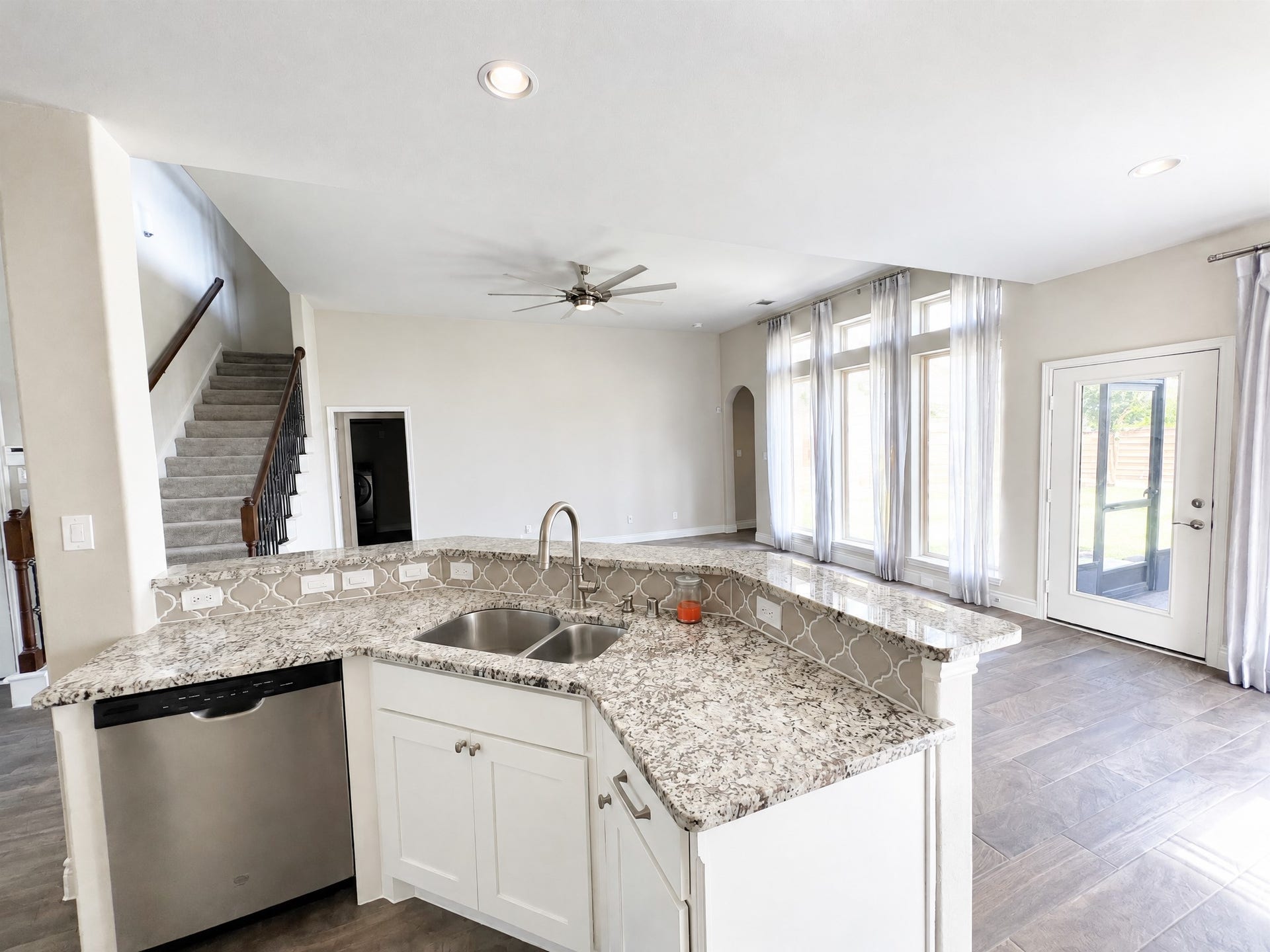 Kitchen contains large gas range with appliances.