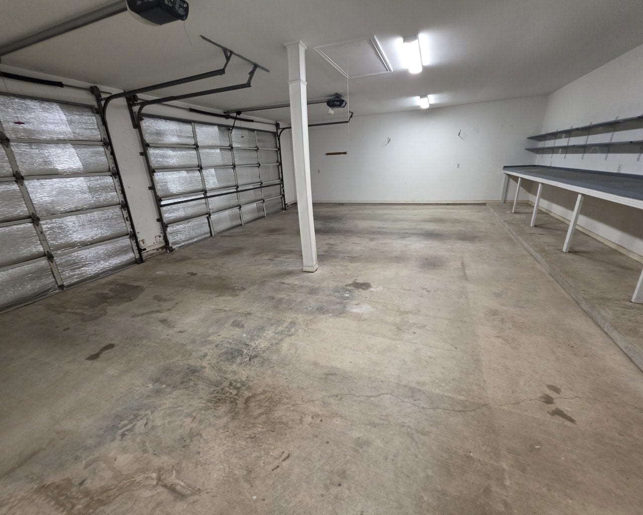 3-car attached garage with work bench