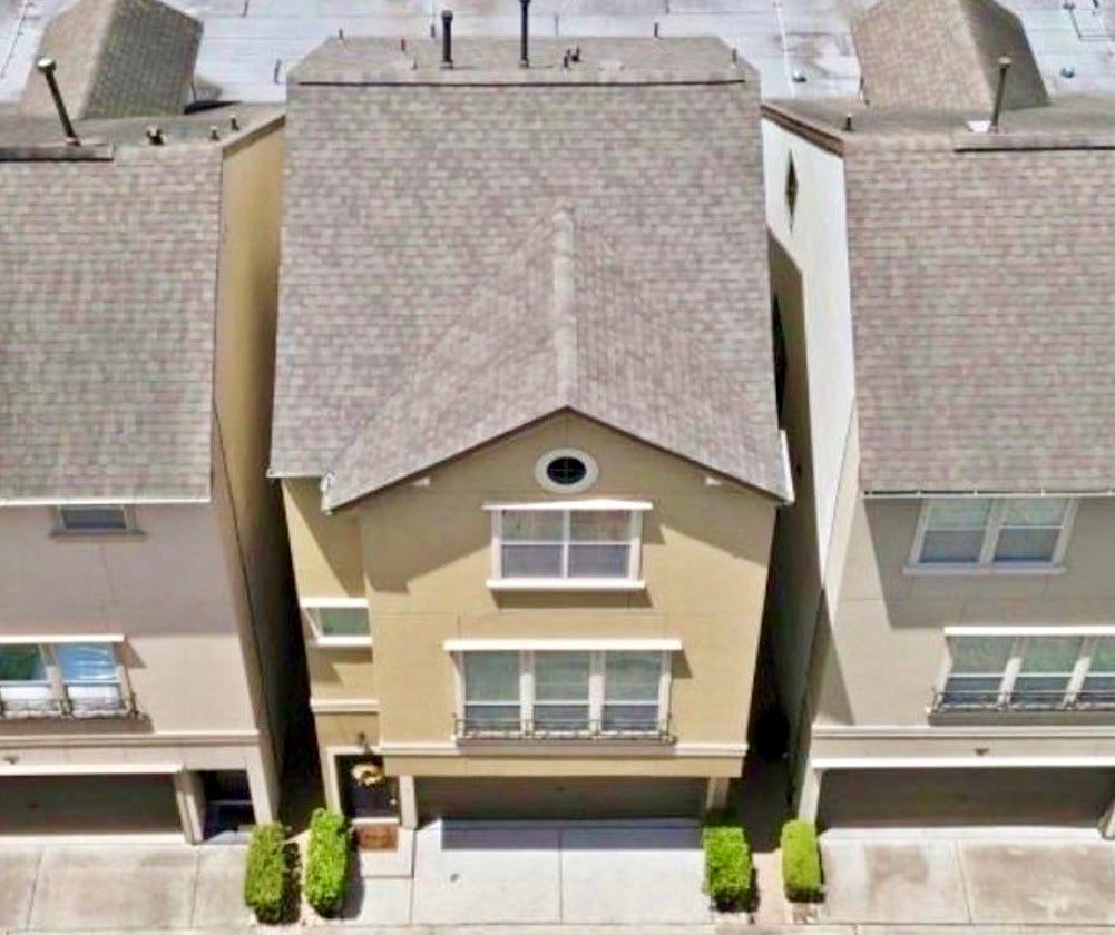 6363 Fairdale Lane, #L, Houston, TX 77057 Front view of the brand new sturdy 30 year roof. Front drive and patio also recently pressure washed, and front stucco facade has been freshly sealed & maintained.