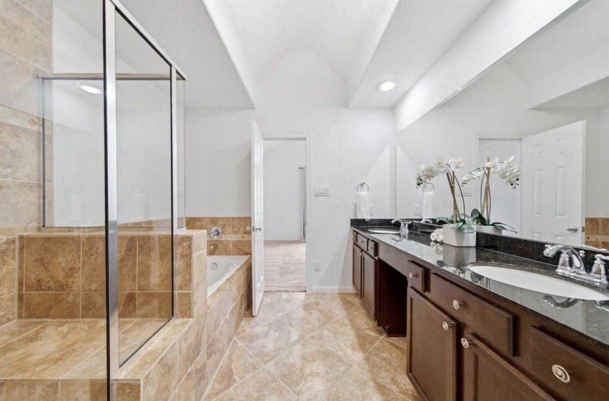 6363 Fairdale Lane, #L, Houston, TX 77057 Primary bath features: built-in VANITY, double sinks, granite counters, maple cabinetry with nickel hardware, chrome fixtures, large walk-in shower w/bench seat, new mirror & recessed lighting, and lightly-used JETTED whirlpool tub!