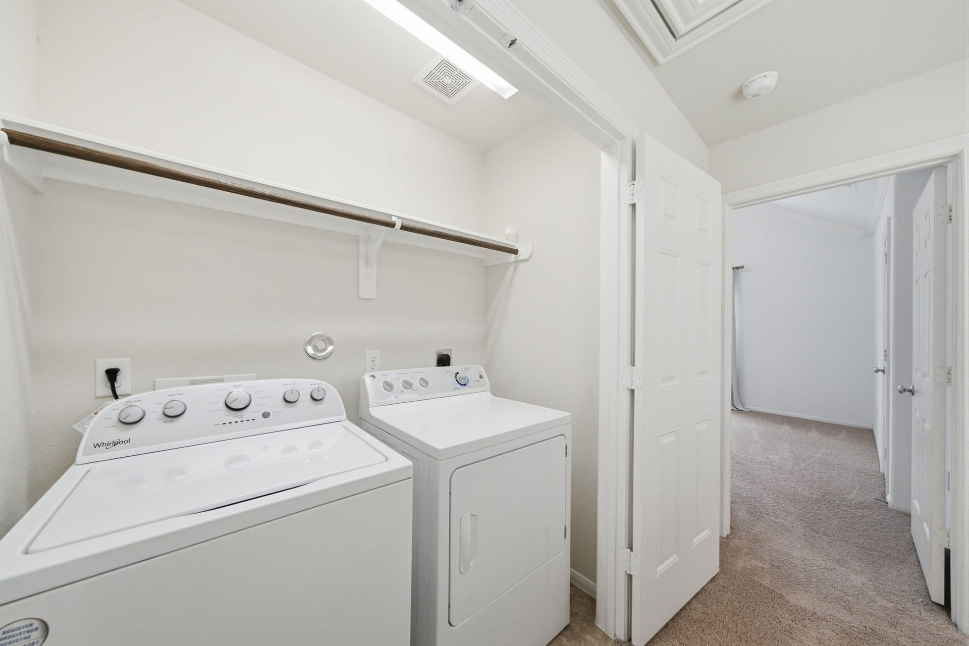 6363 Fairdale Lane, #L, Houston, TX 77057 Laundry room conveniently-located between the two bedrooms on the 3rd floor. Comes equipped with a full-size WASHER and DRYER, floating shelf and hanging rod!