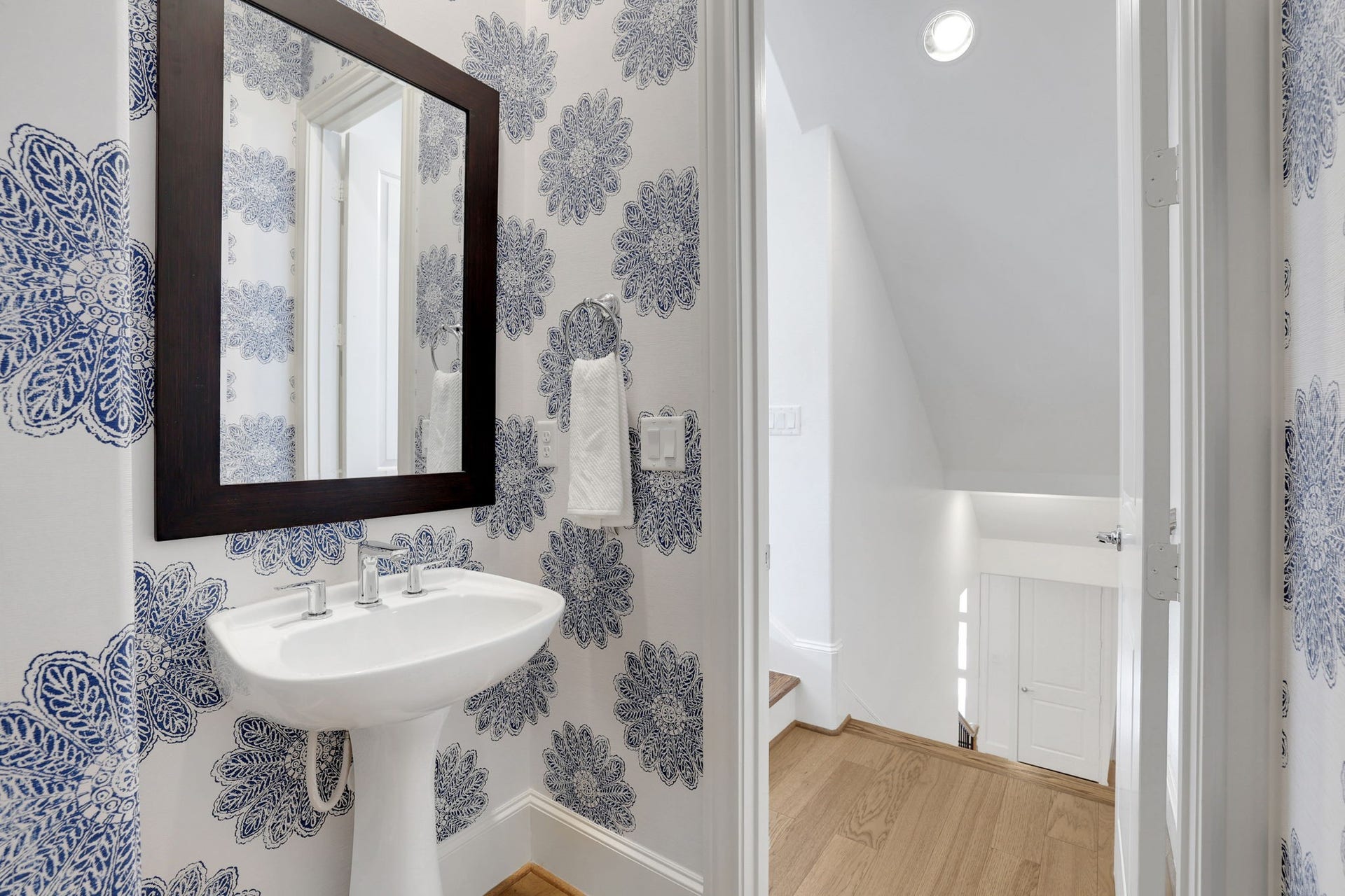 4045 Leeland Street, Houston, TX 77023 This half bath leading to the second floor is perfectly situated for guests