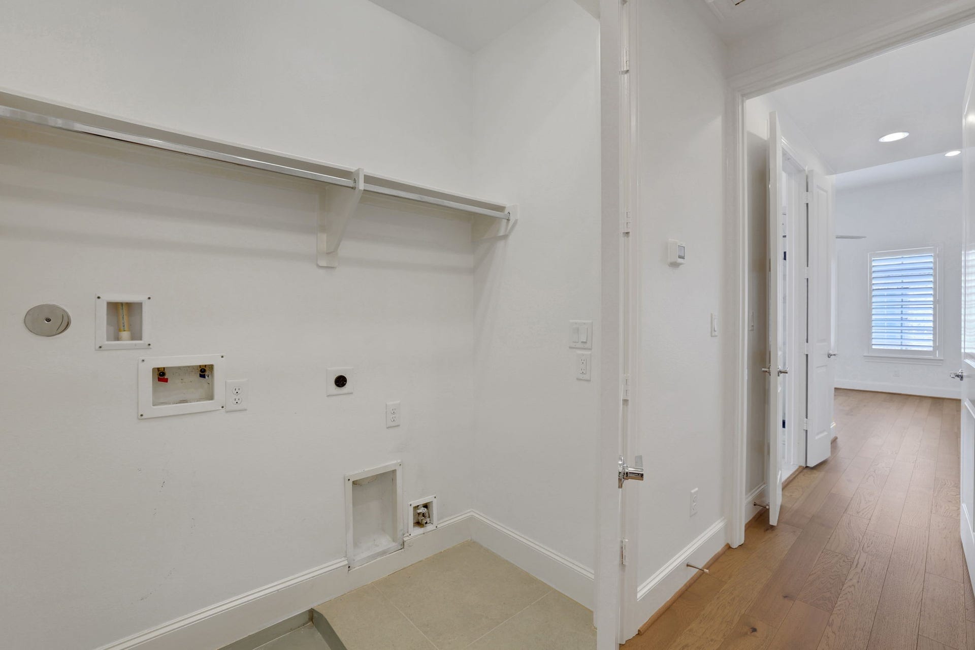 4045 Leeland Street, Houston, TX 77023 The laundry room is conveniently located steps away from the primary bedroom!