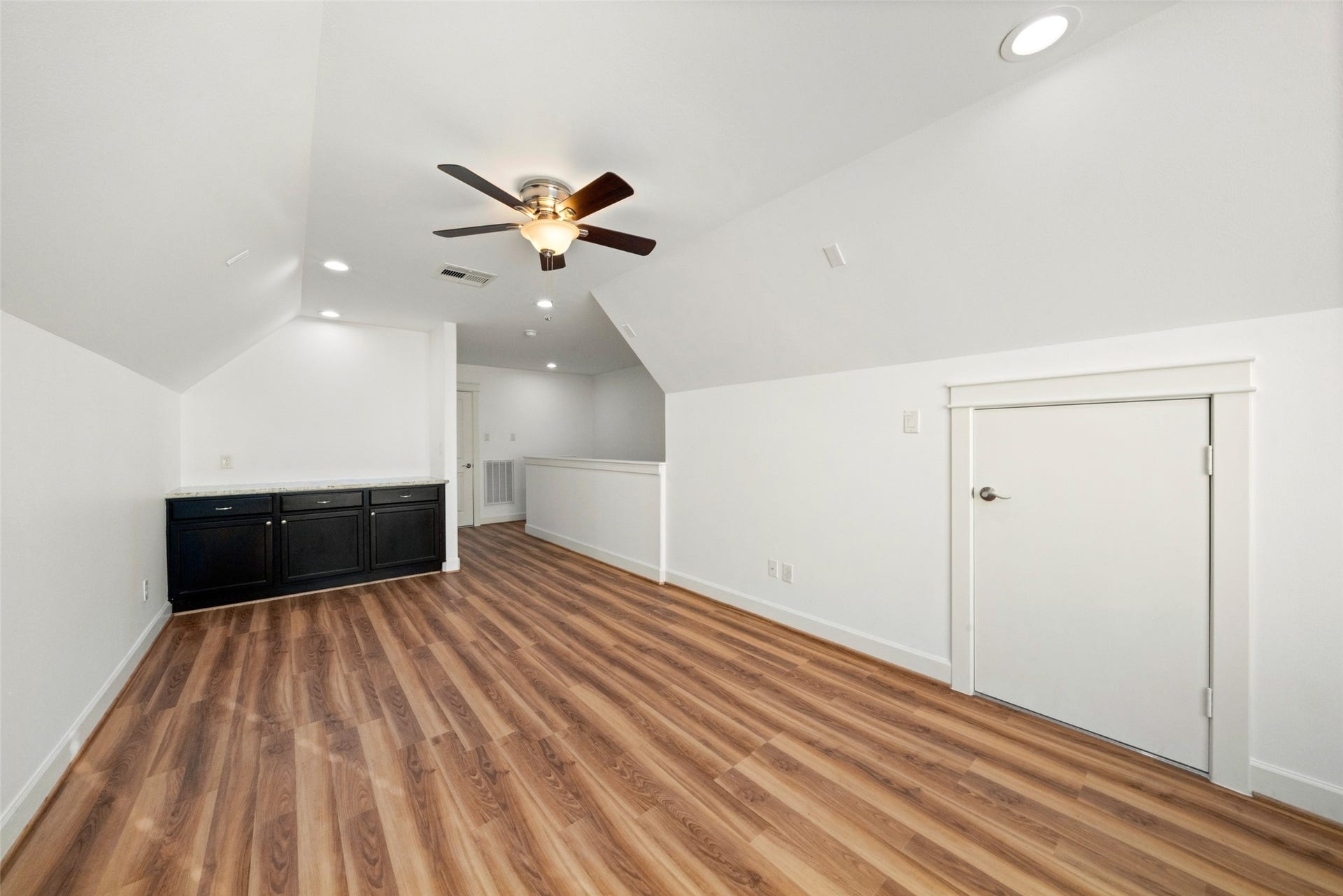904 W 20th Street, #A, Houston, TX 77008 Your HUGE game room!! Also with new luxury vinyl plank flooring, updated recessed lights and large windows for loads of natural light. This space would be perfect for a private study/office also!