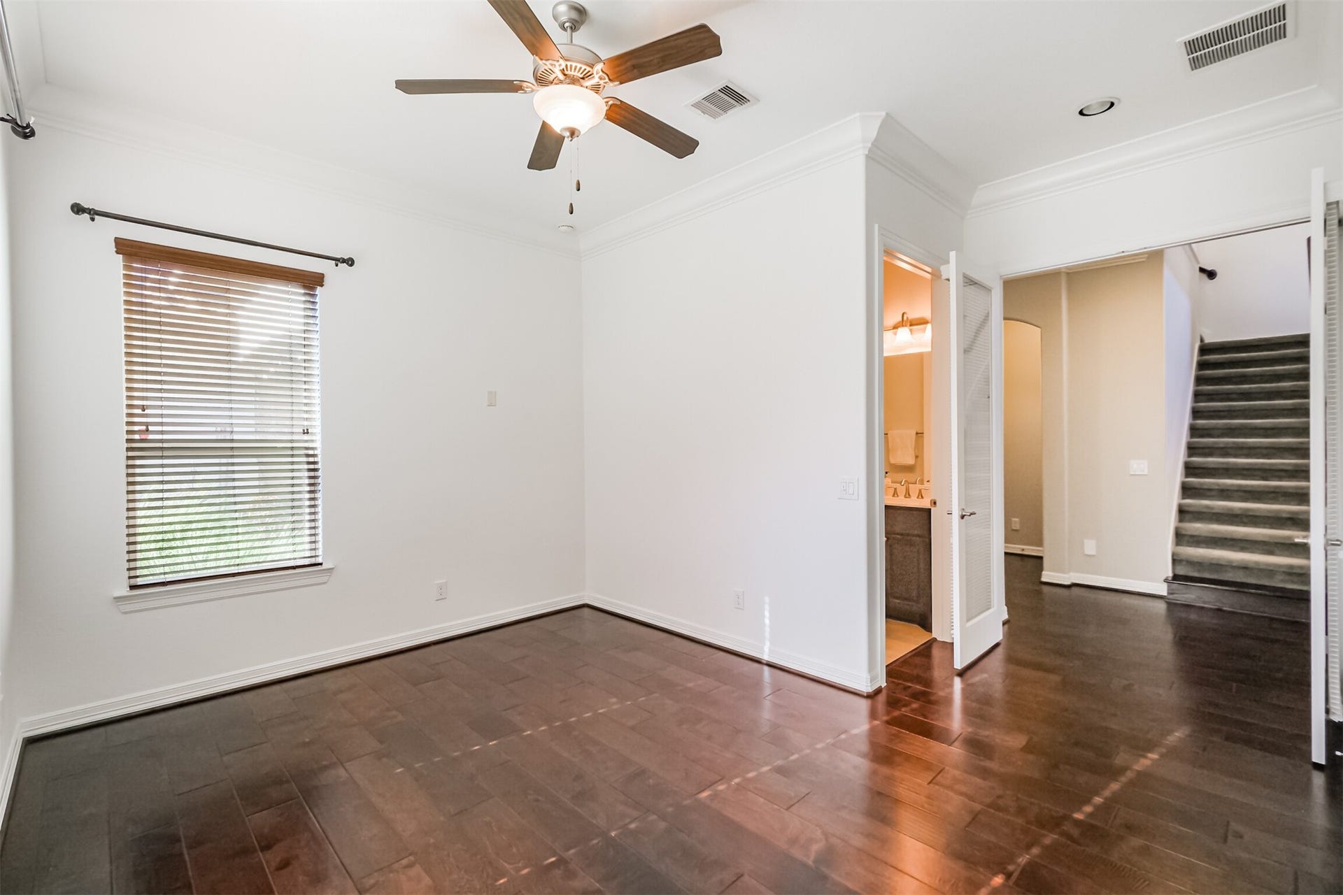 10 Silent Way Drive, Sugar Land, TX 77498 Versatile study/ secondary bedroom on first floor featuring French glass doors and a full bathroom.