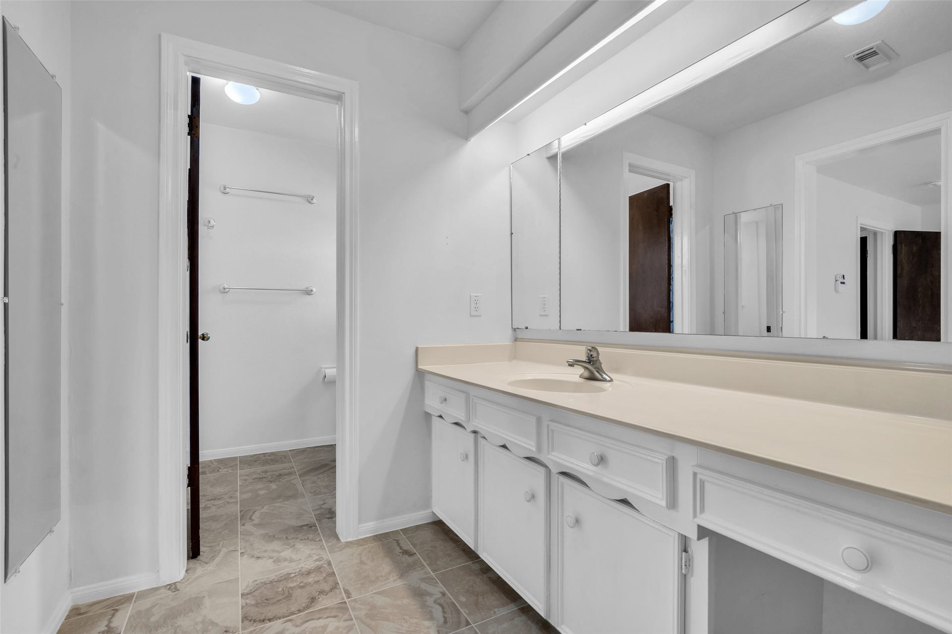 Primary Suite bath with vanity area.