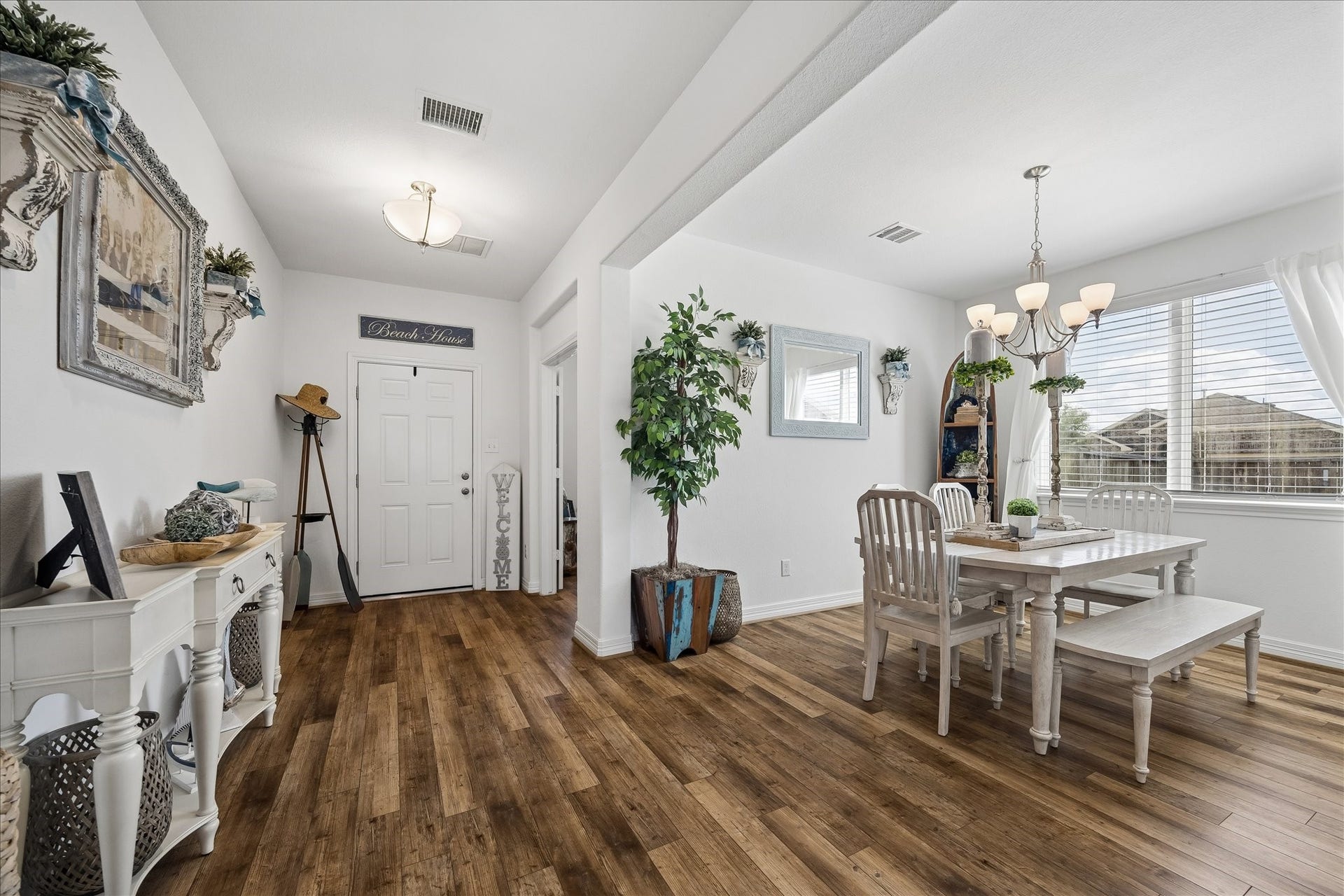 25934 Bronze Oak Court, Richmond, TX 77406 A welcoming entry leads to the formal dining room, with the family room and kitchen directly ahead, creating an easy flow that feels ready for both everyday living and special gatherings.