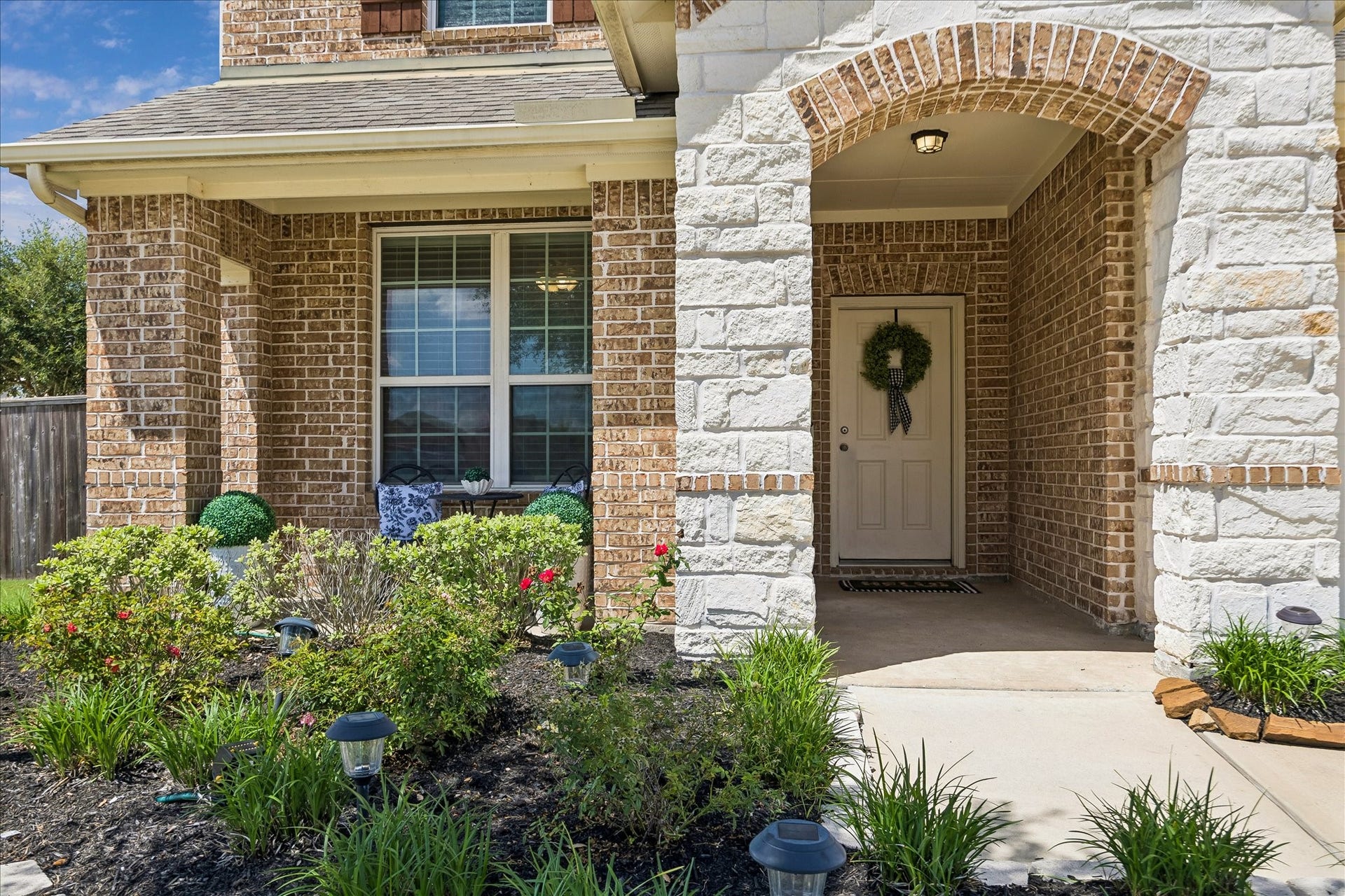 25934 Bronze Oak Court, Richmond, TX 77406 A handsome brick and stone exterior, manicured landscaping and a deep covered entry create a warm welcome and hint at the care found throughout this beautiful home.