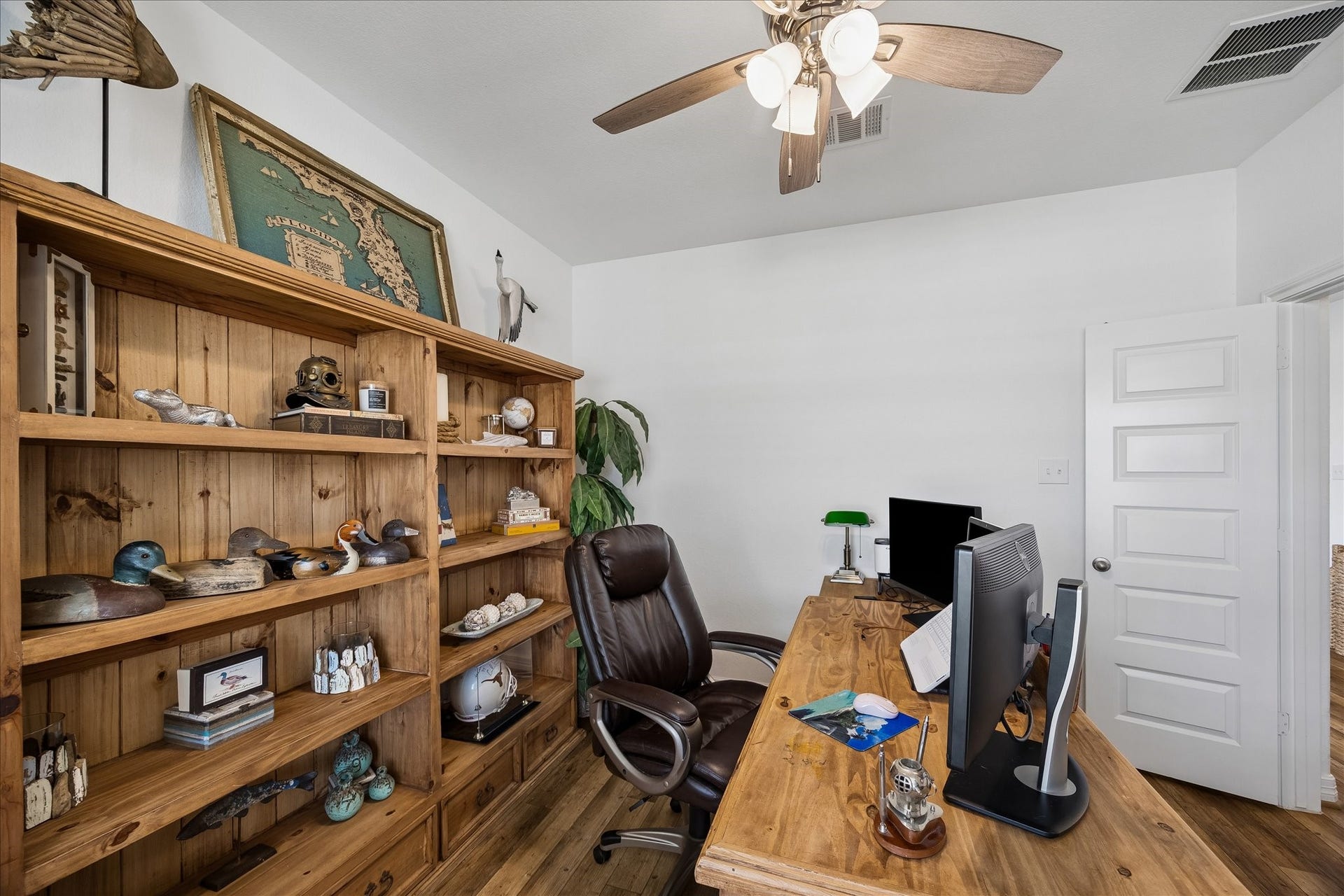 25934 Bronze Oak Court, Richmond, TX 77406 Perfect for the at home pro, this spacious study offers a quiet, peaceful setting to stay productive with LVP flooring, neutral paint, front yard views and wood French doors for added privacy.