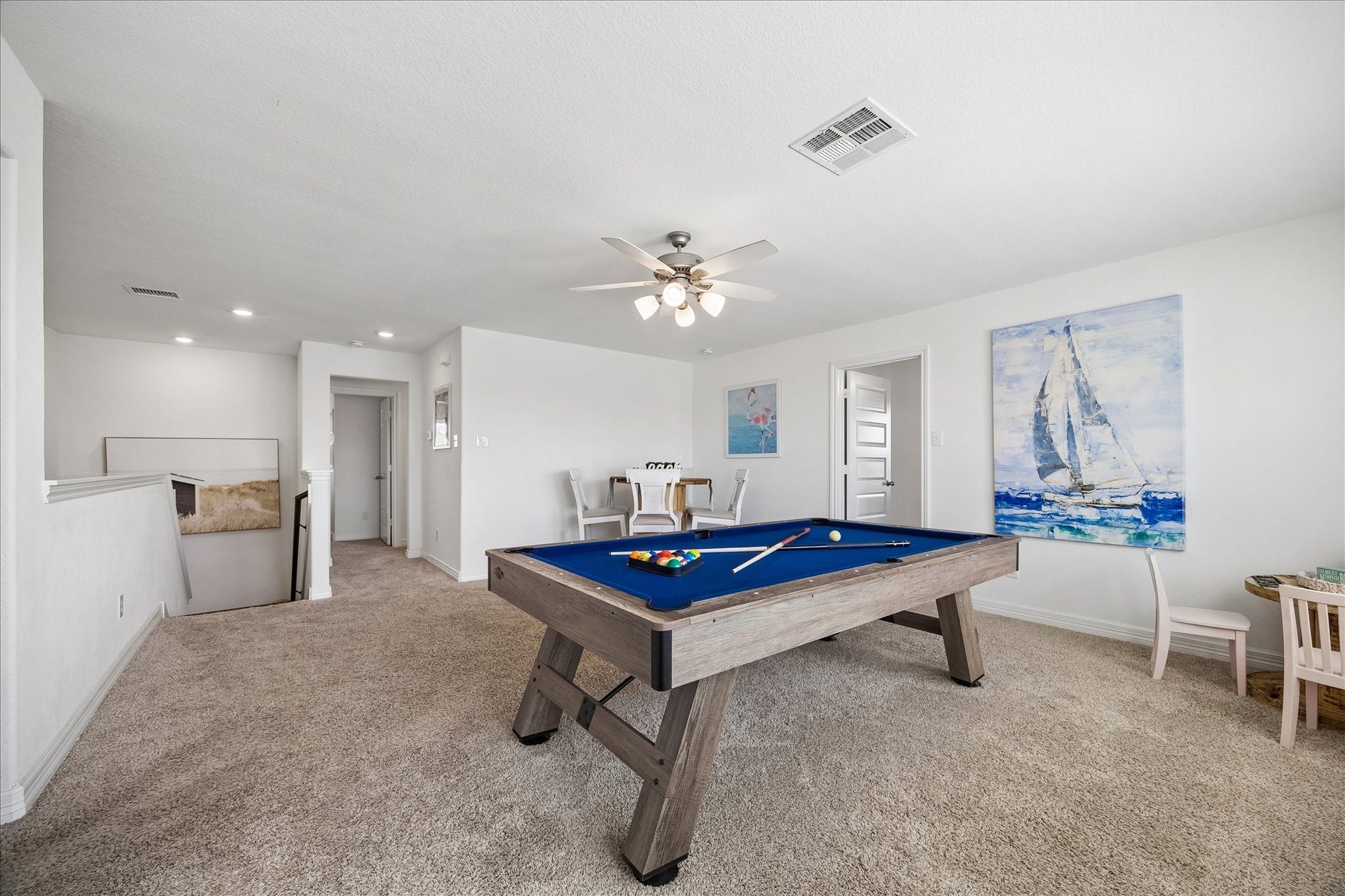 25934 Bronze Oak Court, Richmond, TX 77406 Bright, open and ready for fun, this versatile game room offers plenty of space to play, gather and unwind, with a large storage closet, cooling ceiling fan, soft neutral finishes and oversized windows that fill the room with natural light.