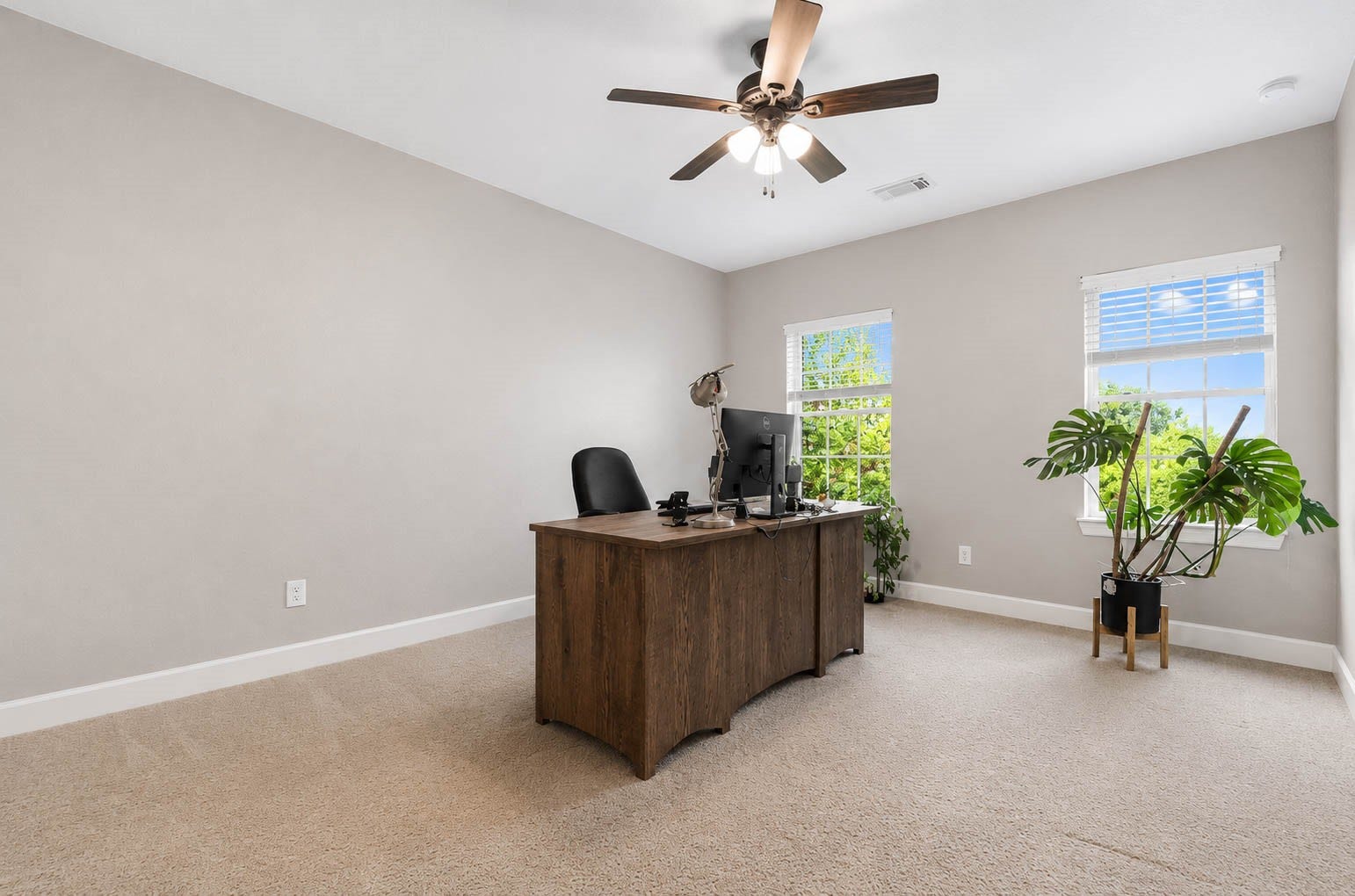 5331 W Farm Way, Fulshear, TX 77441 Two large windows flood this bedroom with natural light.