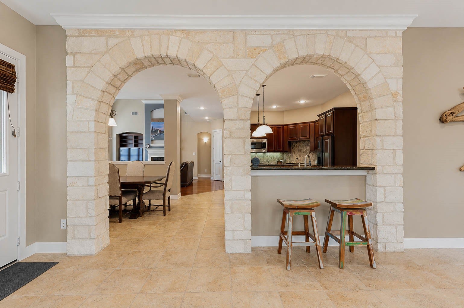 5331 W Farm Way, Fulshear, TX 77441 A closer look at the stone arches that catch the eye and add architectural dimension throughout the home.