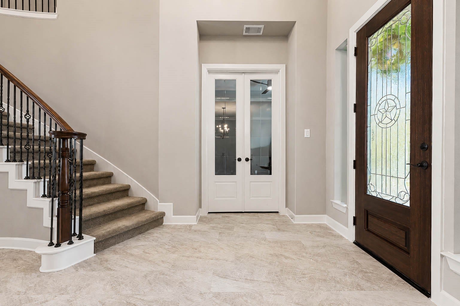 5331 W Farm Way, Fulshear, TX 77441 To the right of the entryway, a private study awaits behind elegant double French doors, offering a quiet space for work or reading.
