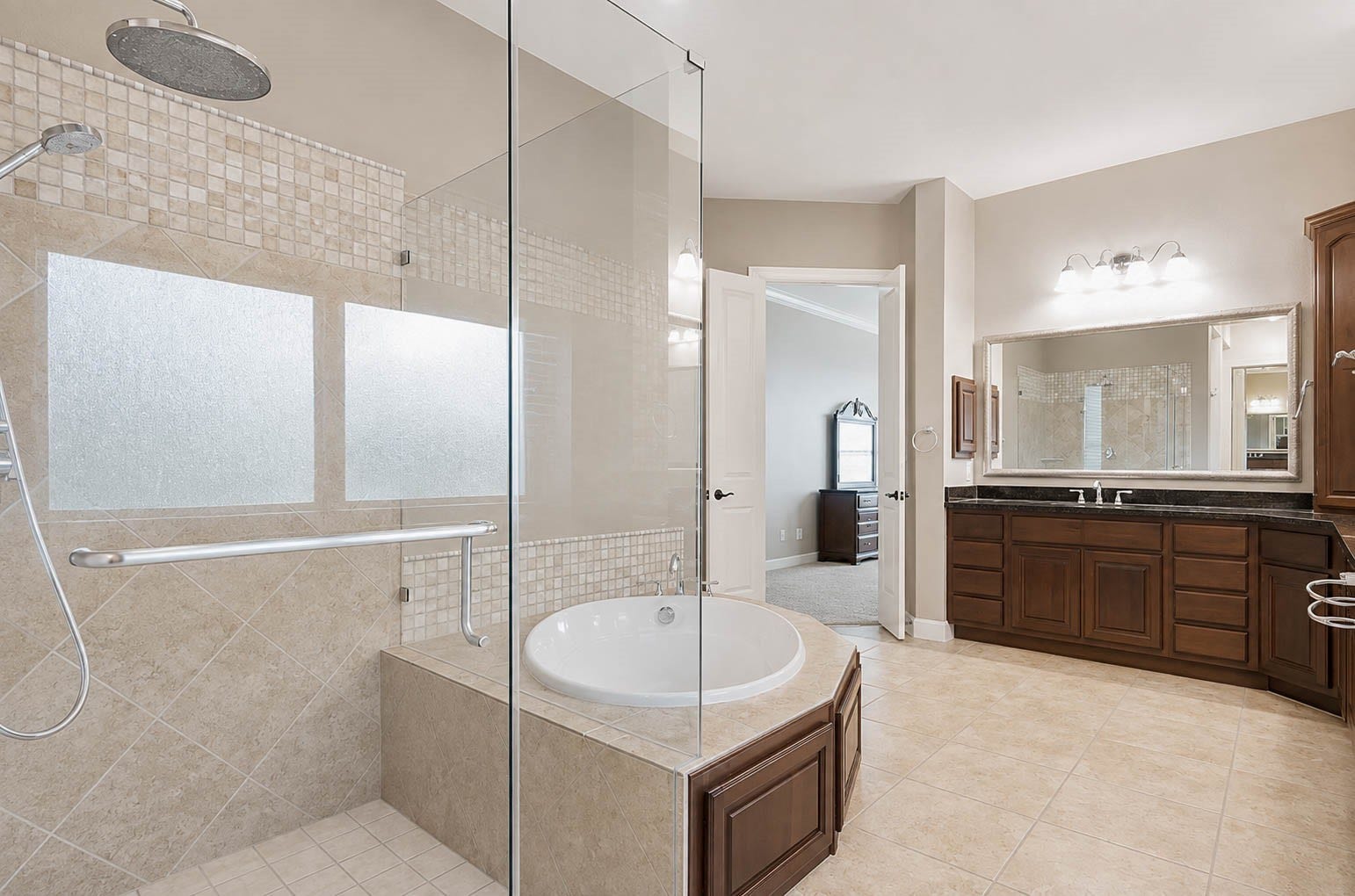 5331 W Farm Way, Fulshear, TX 77441 The walk in shower is complete with a rain showerhead and handheld wand, and the home includes a whole home water softener for added comfort throughout.