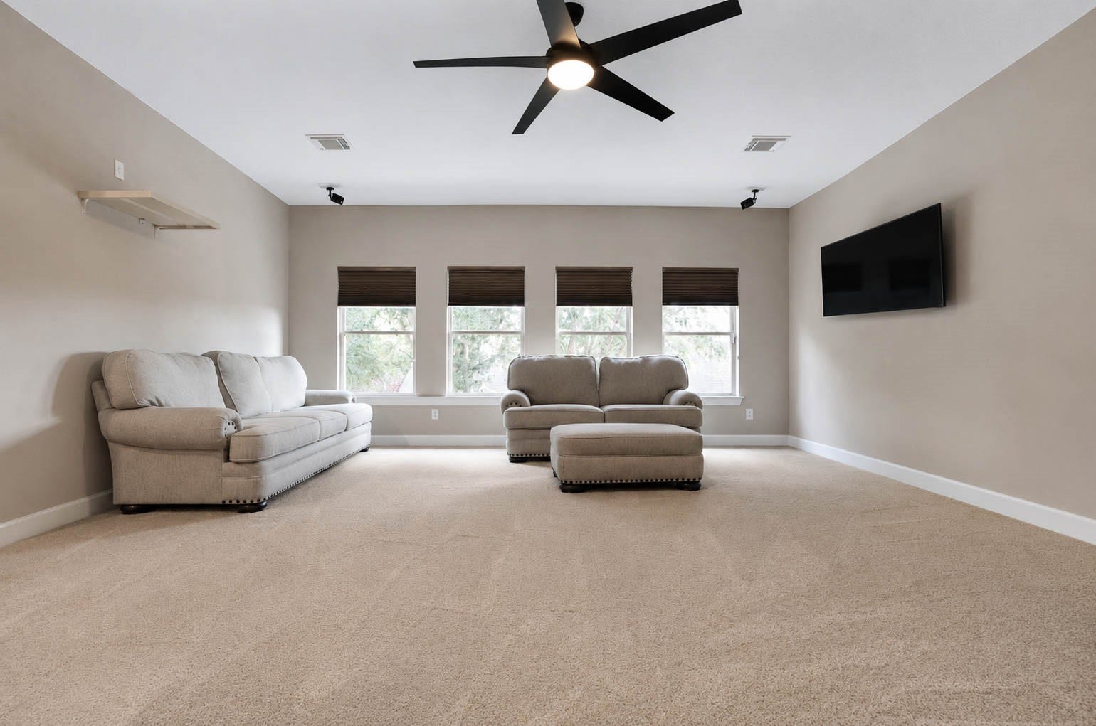5331 W Farm Way, Fulshear, TX 77441 Upstairs, the second floor offers a spacious ~460 square foot game room complete with surround sound, plush carpet, and a wall of windows, along with three additional bedrooms and two full bathrooms.