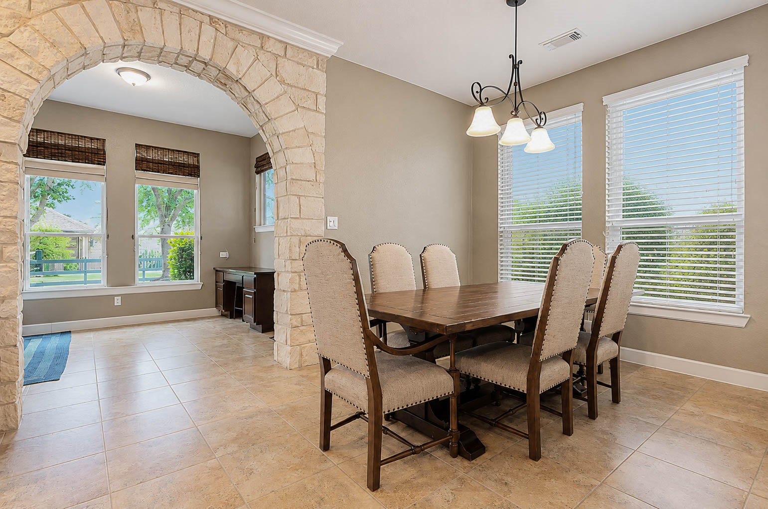 5331 W Farm Way, Fulshear, TX 77441 Just off the kitchen, this warm and inviting breakfast area sits beneath a stylish light fixture and large windows. You also have plenty of room for a table and chairs for many guests.