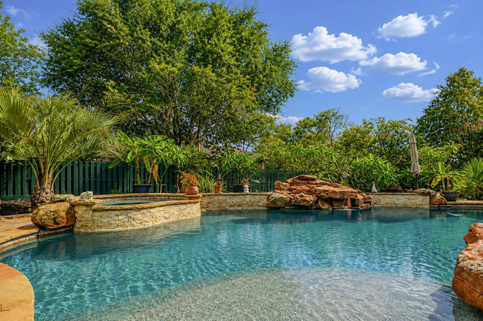 5331 W Farm Way, Fulshear, TX 77441 This lush backyard offers a true sense of privacy, complete with landscape lighting, a whole yard irrigation system, and a new privacy fence installed in early 2026.