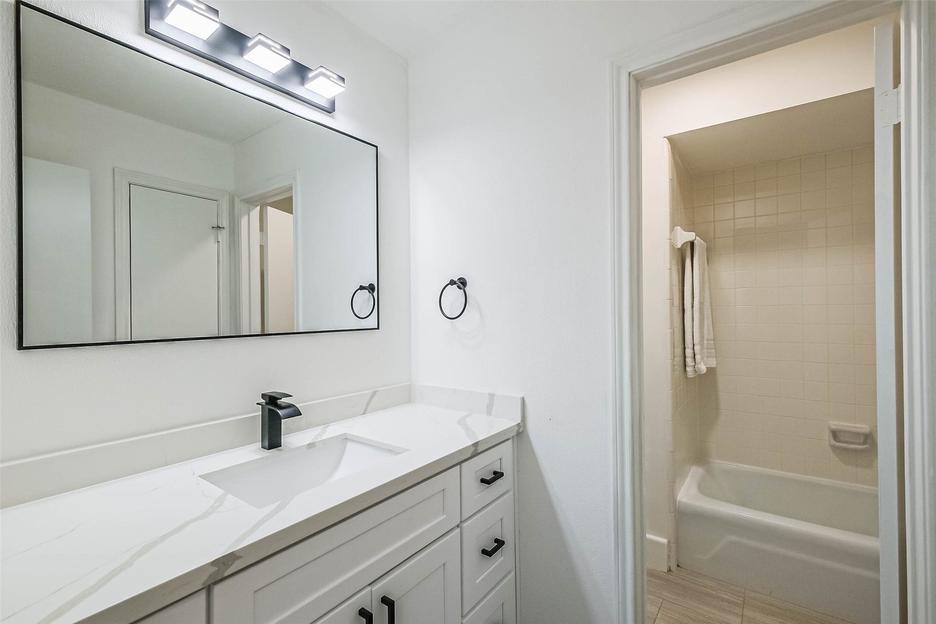 The full bathroom for the 3 other bedrooms on the 2nd floor. Bath / shower combo.