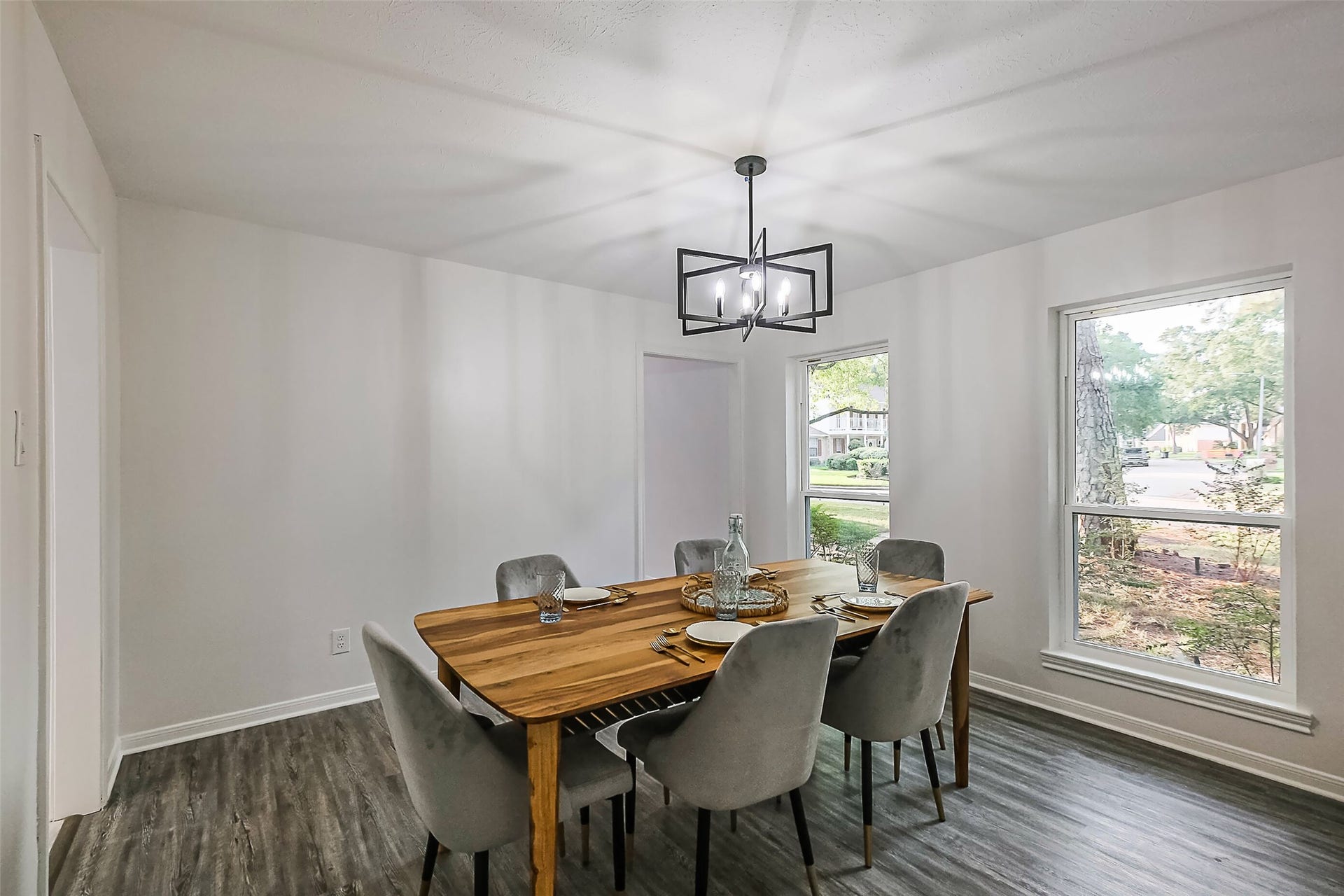 The dining room enjoys pleasant views of the front yard.