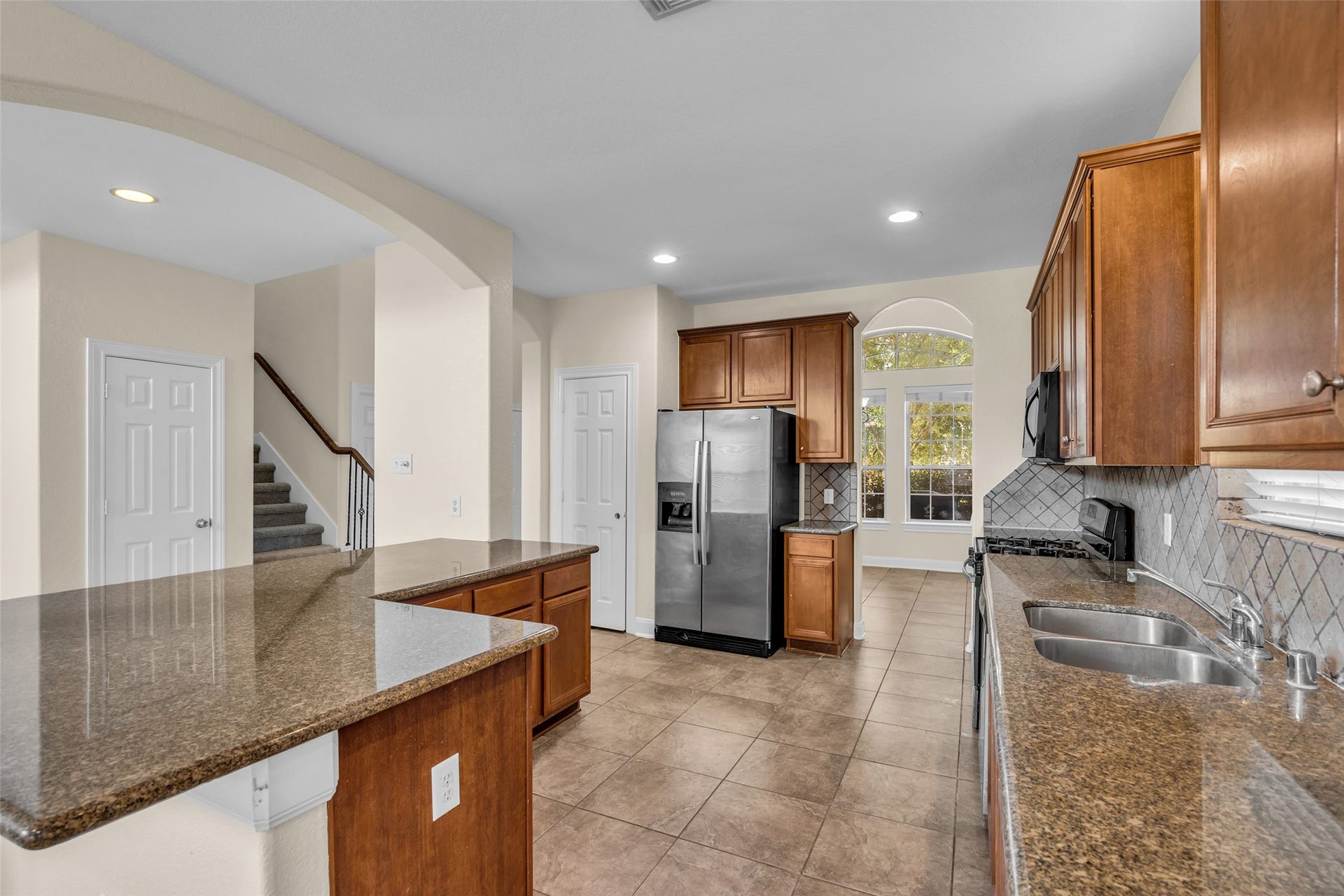 9907 Heritage Waters Court, Humble, TX 77396 This roomy kitchen offers plenty of counter space for meal prep.