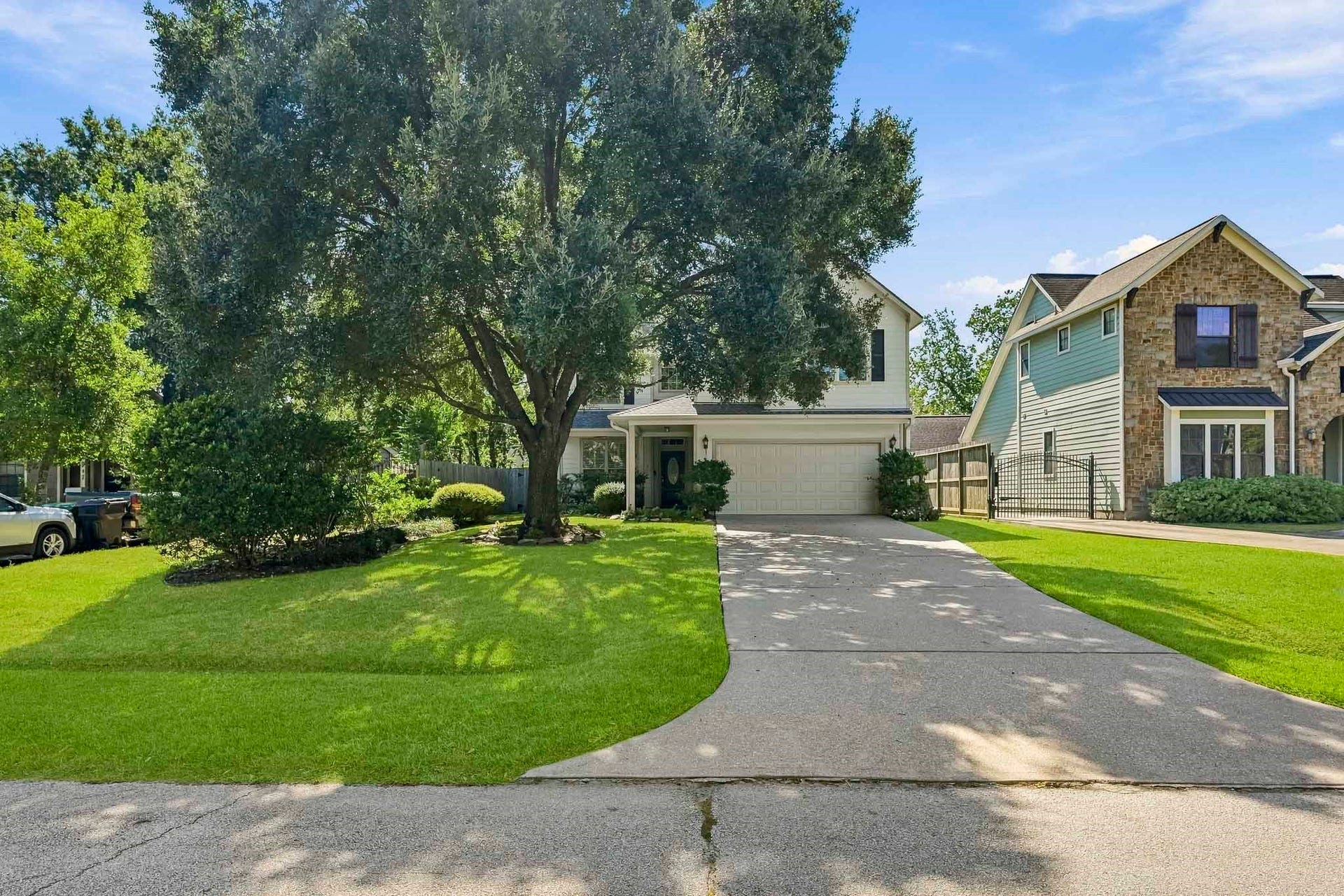 951 Lamonte Lane, Houston, TX 77018 Attractive exterior with mature trees, manicured landscaping, and a charming covered entry.