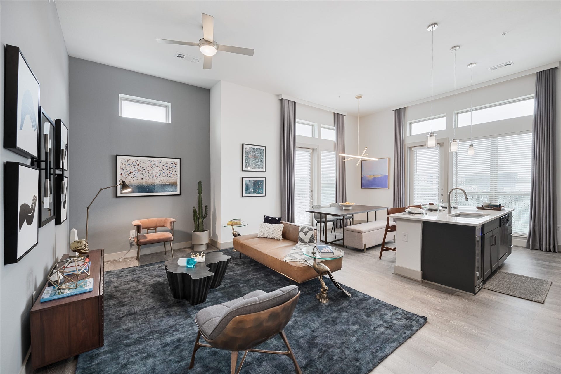 From the soaring ceilings to the beautiful natural light, this home makes an impression the moment you enter. Open living and dining spaces flow effortlessly into the kitchen, creating a wonderful setting for quiet evenings at home or gathering with friends.