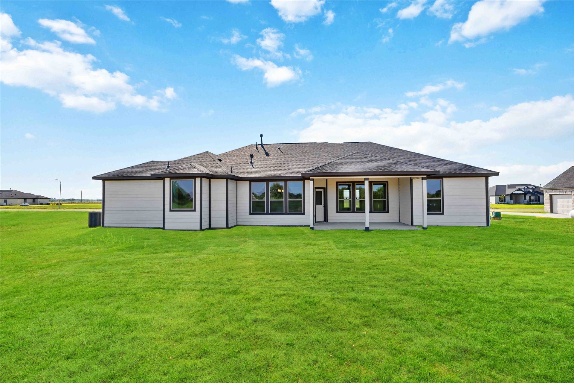 6702 Pelican Lane, Beasley, TX 77417 Enjoy outdoor living with an extended covered patio and a three-car garage to suit your needs.
