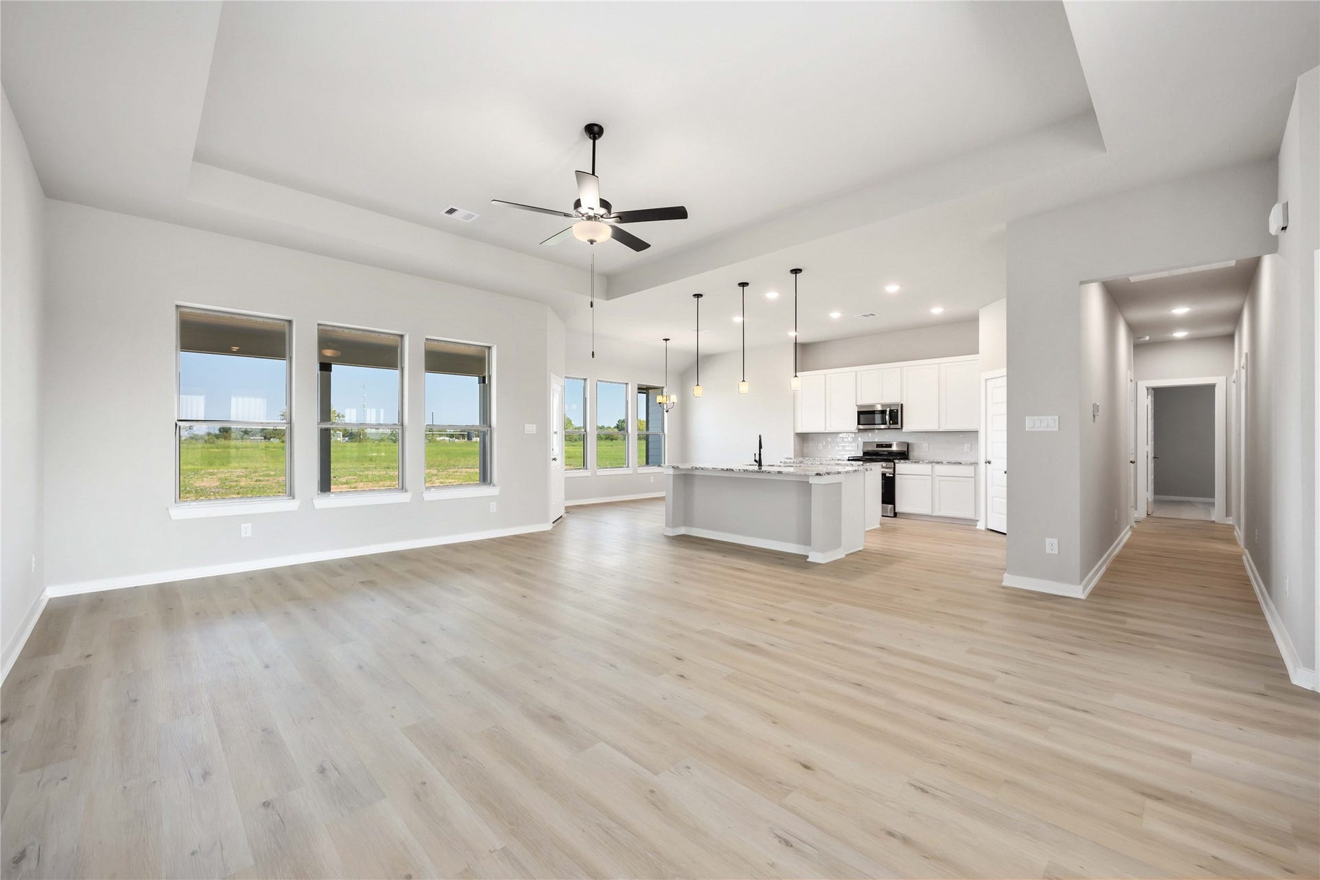 6702 Pelican Lane, Beasley, TX 77417 This home features a spacious, open-concept layout and an expansive family room connected to a gourmet kitchen and a bright breakfast area.